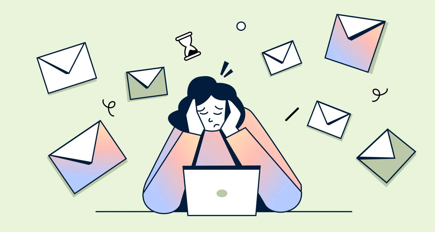 Stressed agent at a laptop surrounded by envelopes, illustrating the challenges of high-volume email management