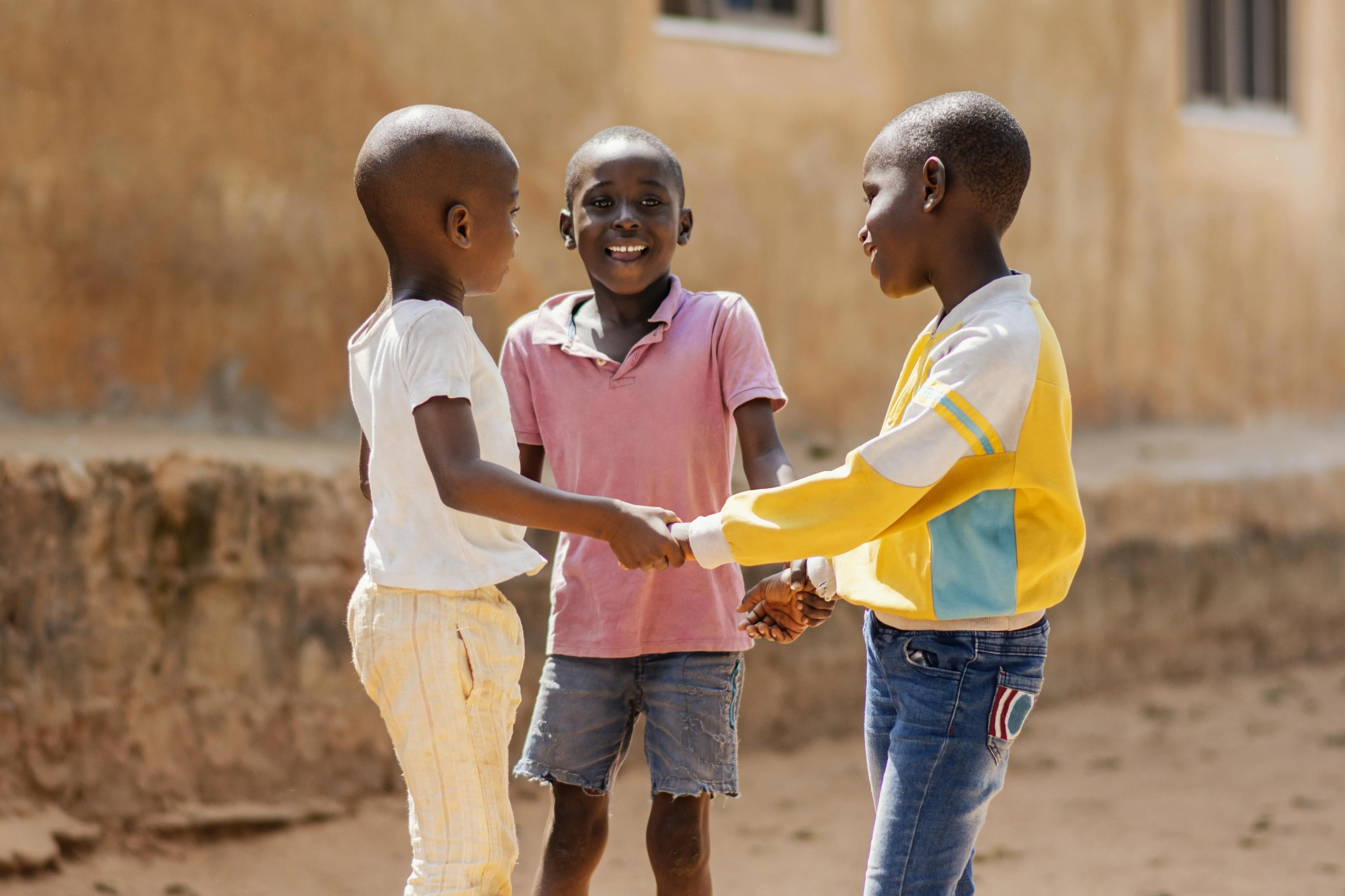 medium-shot-smiley-african-boys-playing-together