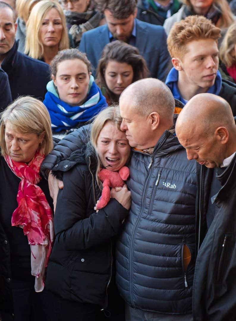 Jack Merritt’s girlfriend Leanne O’Brien (centre left) and father David (centre right) during a vigil at the Guildhall in Cambridge to honour both Jack and Saskia Jones after the two of them were killed in Friday’s London Bridge terror attack (Joe Giddens/PA)