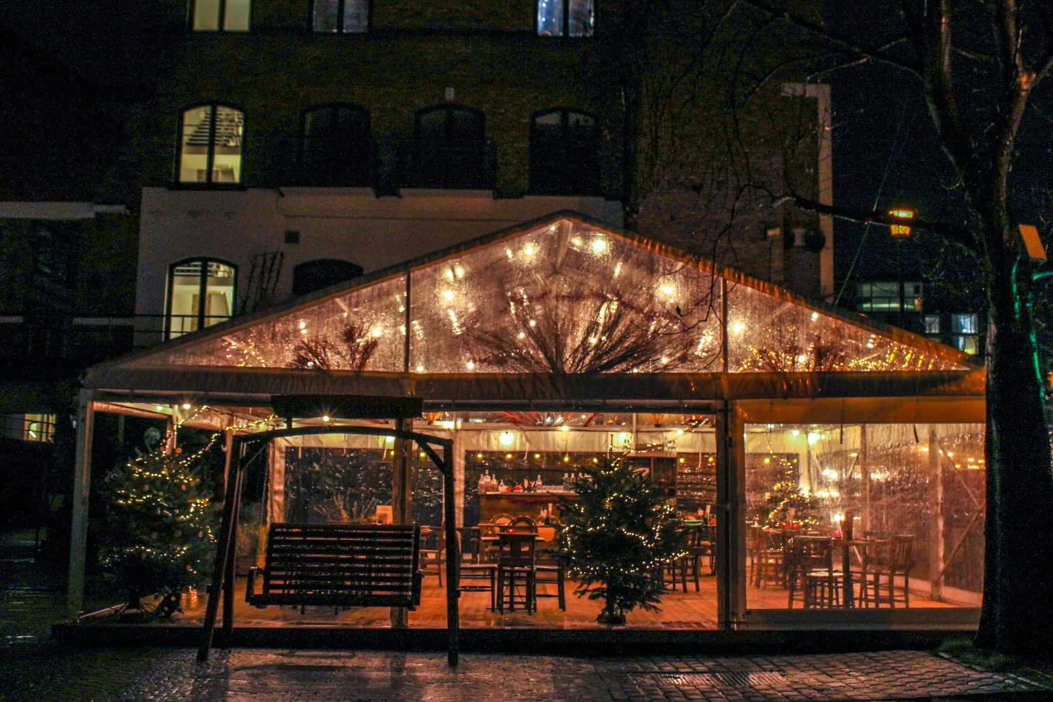 Exterior Tent Night - The Botanist Winter Tent festive drink