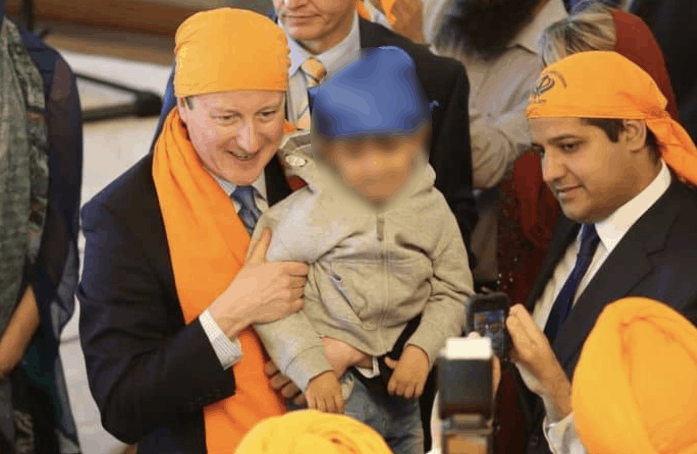 Samir Jassal (right) with David Cameron on a visit to a Sikh place of worship in Kent, 2015