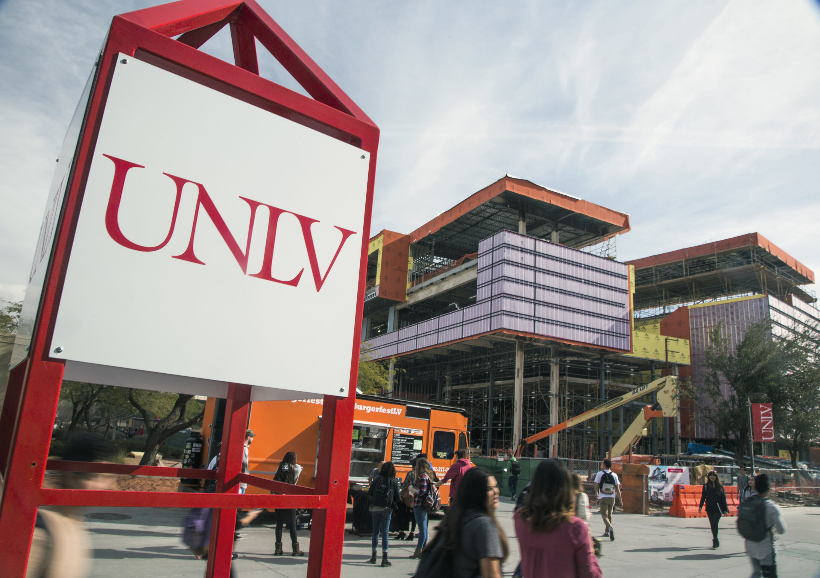 The UNLV Sign in front of the Hospitality Hall under construction