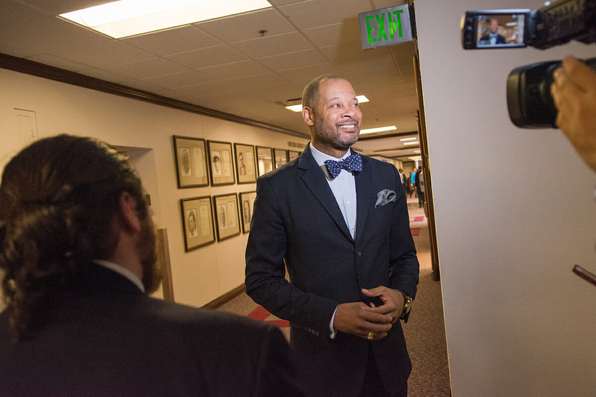 Aaron Ford in a dark jacket and bow tie during an interview