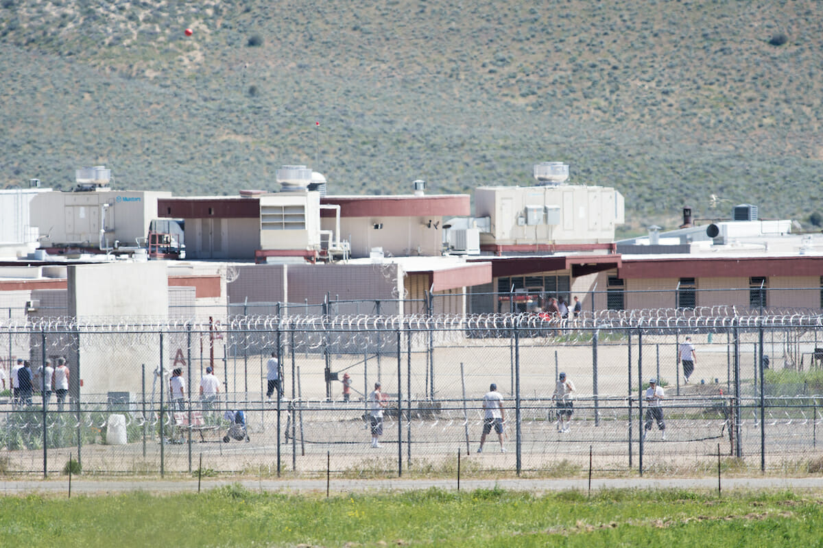 Inmates in the yard of a correctional facility.