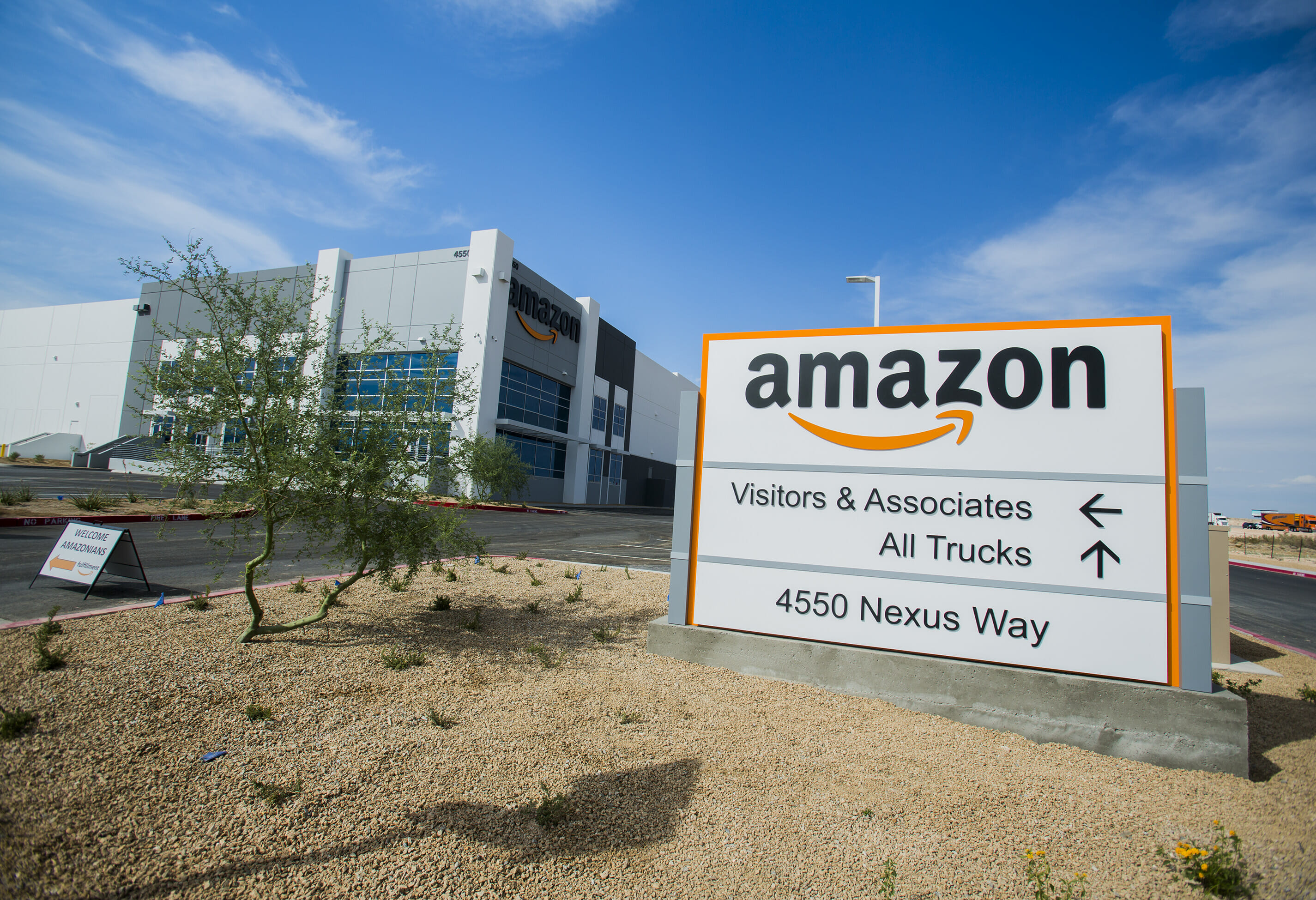 A sign for an Amazon distribution center, including the company's logo