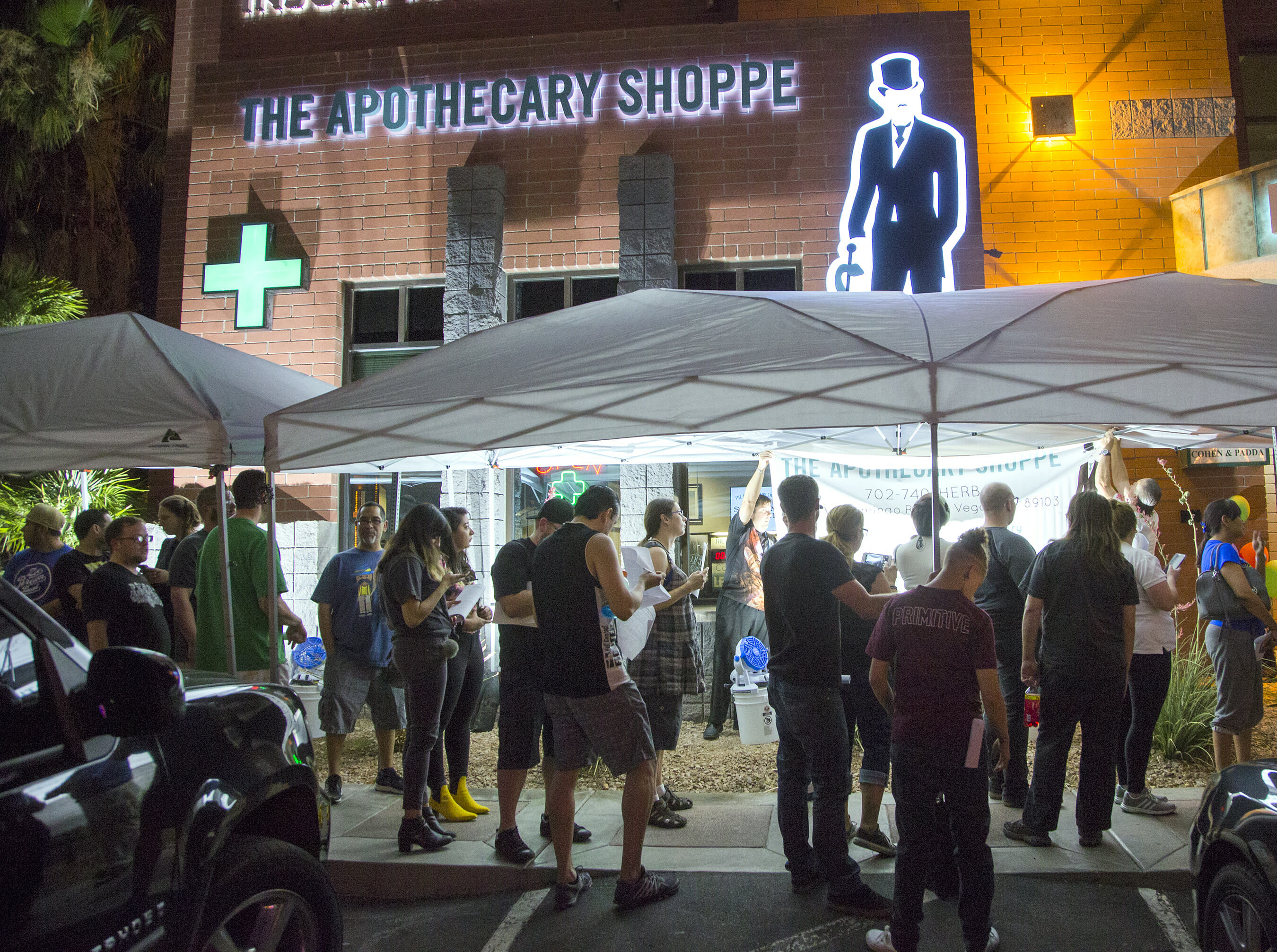 People stand in line at dispensary