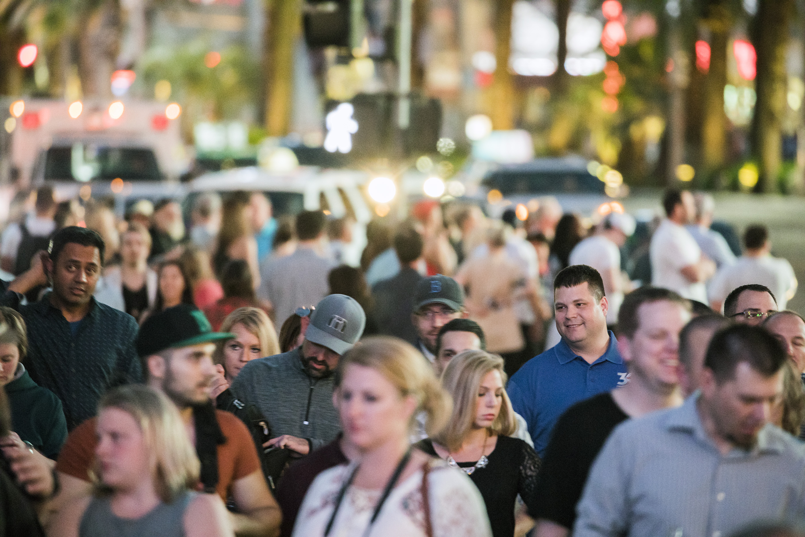 A crowd of people walking down Las Vegas Boulevard