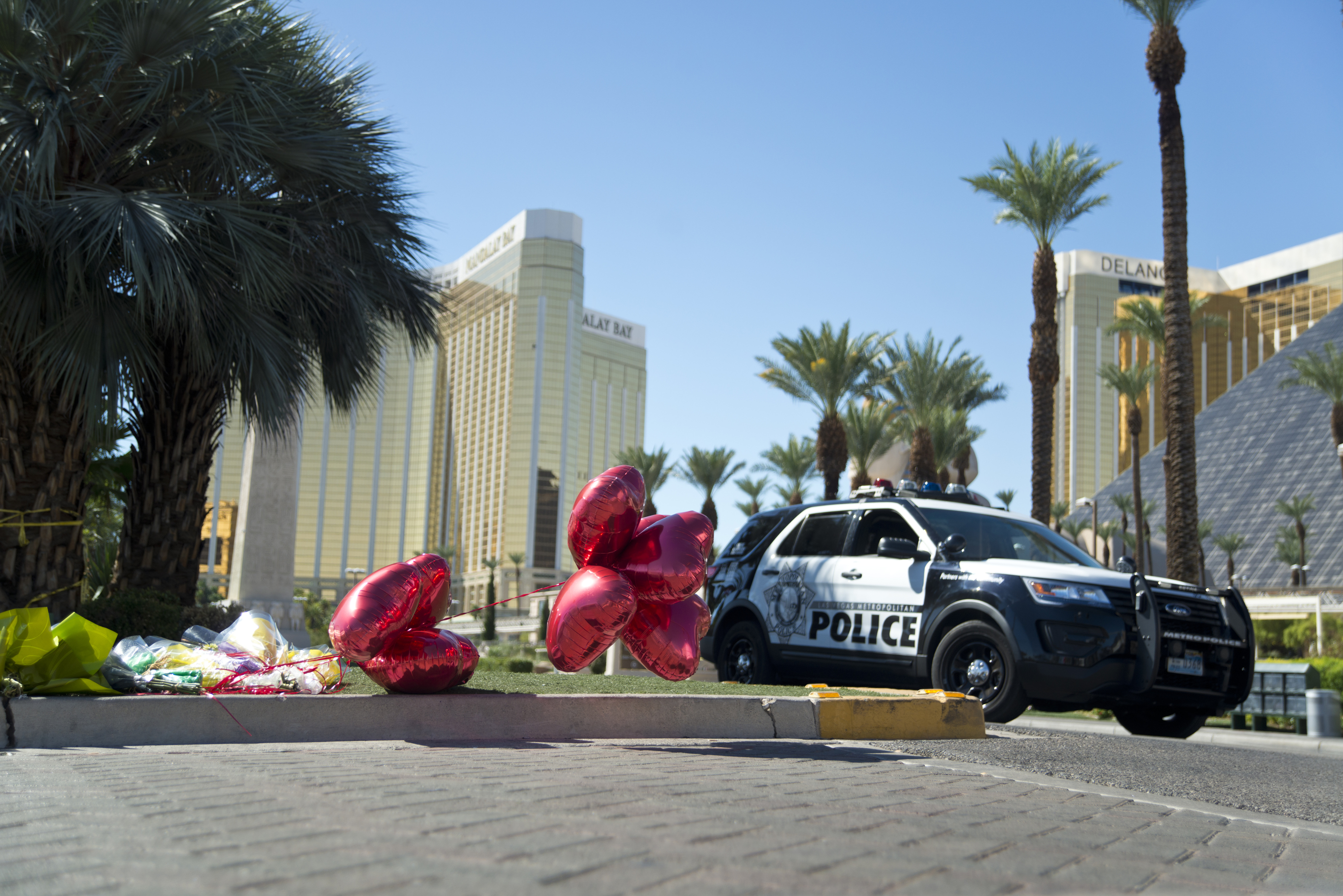 Flowers lay on the ground near the Route 91 Festival grounds