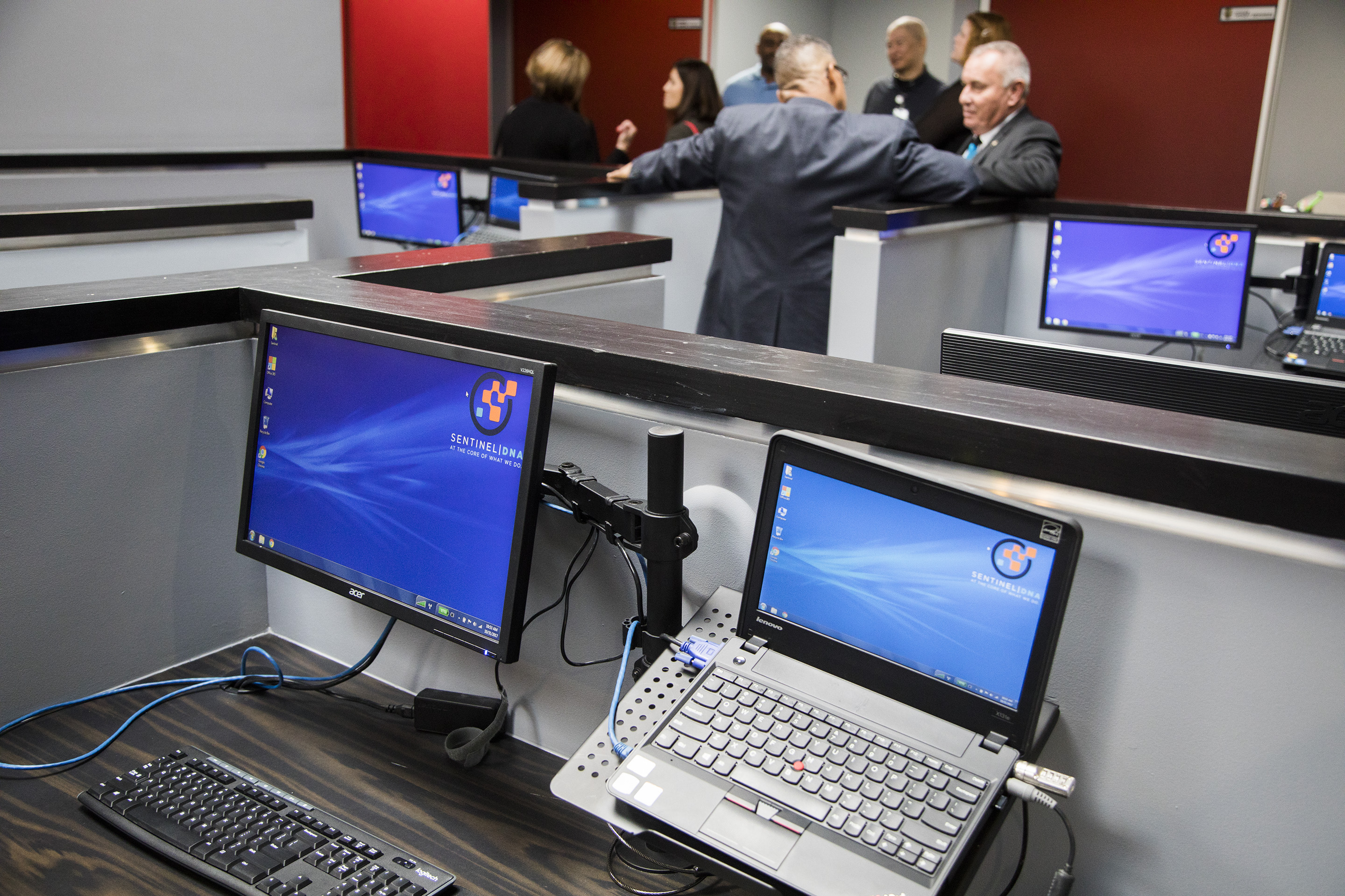 Four computers in a computer room