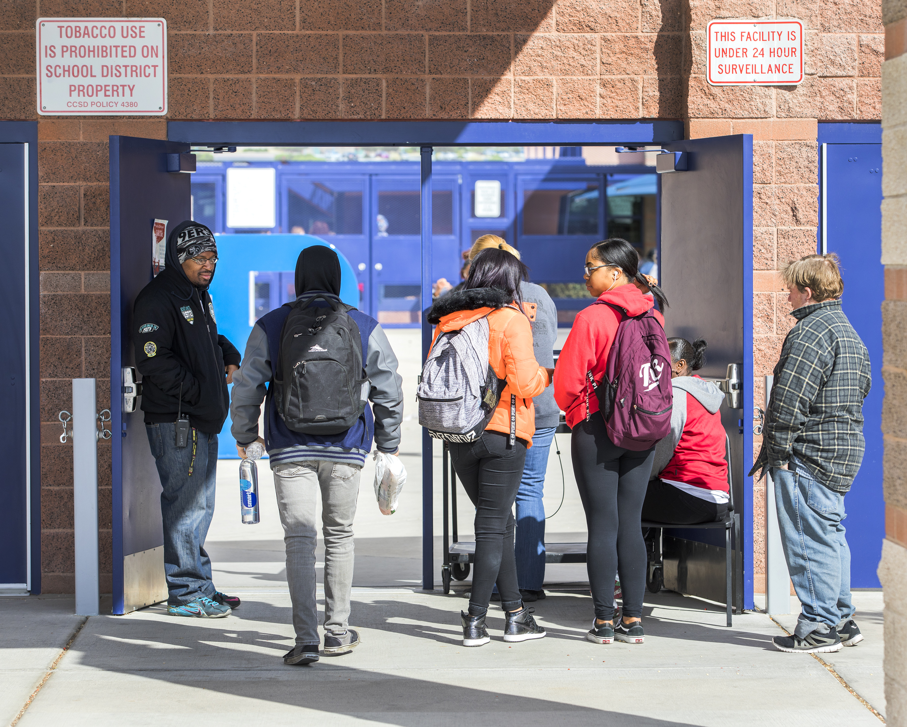 Students walking through a school security checkpoint