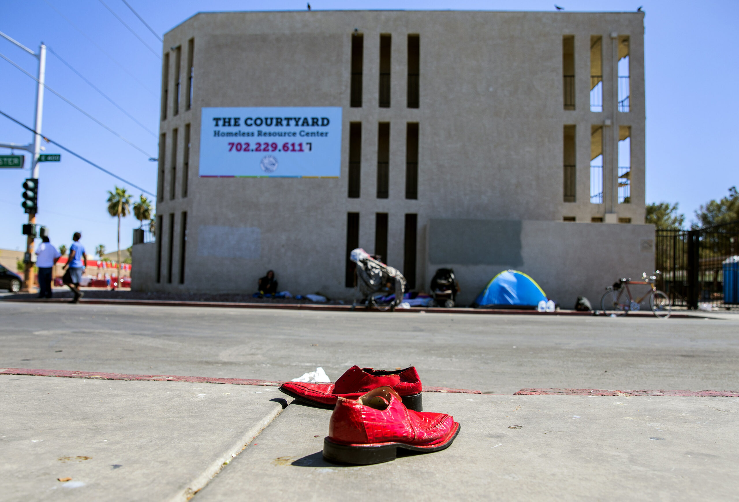 Abandoned shoes on a sidewalk