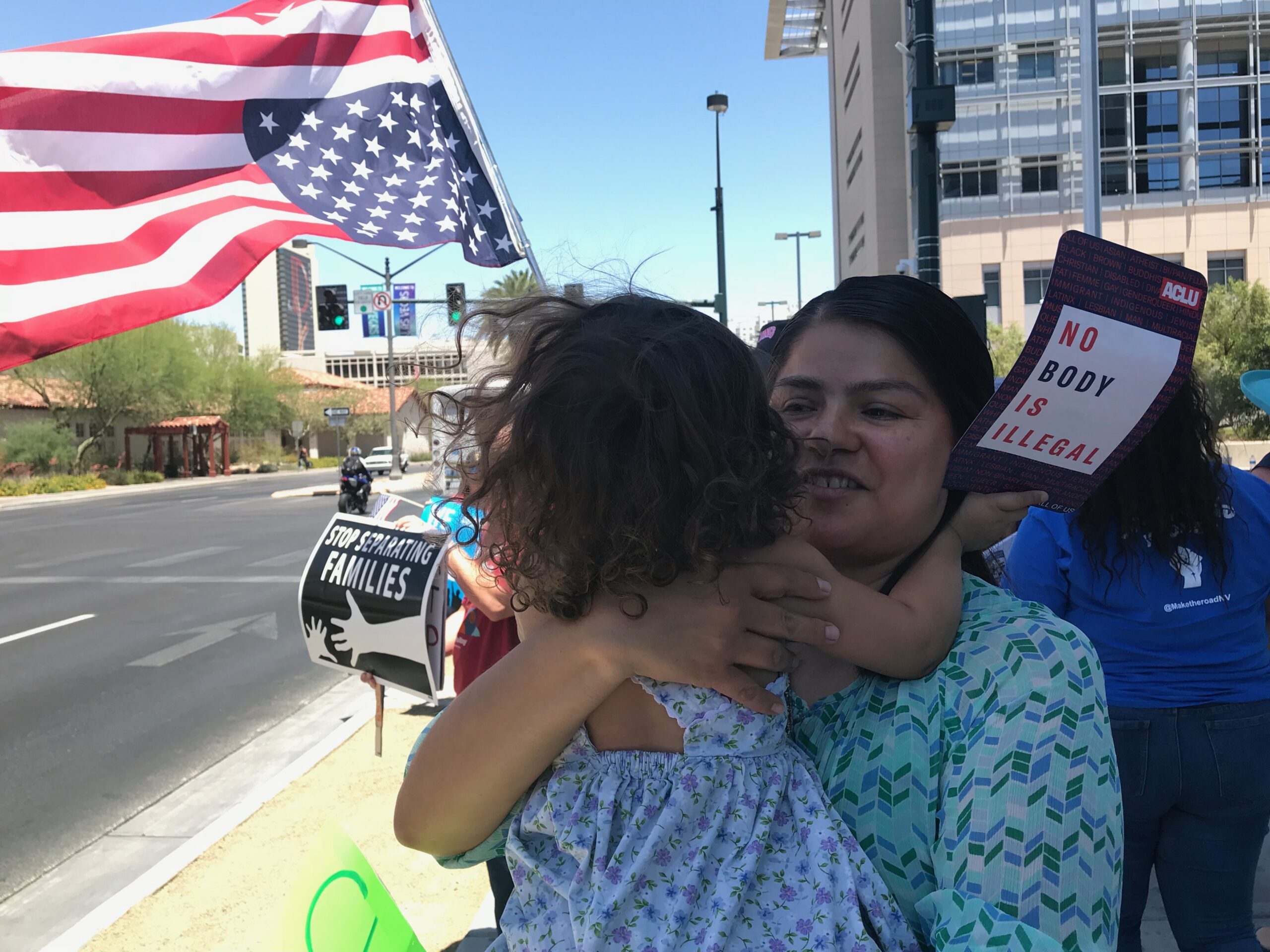 Ireri Bravo, part of the immigrant advocacy group We Belong Together, carries her daughter Elena during the "Day of Action" event outside the ICE offices en Las Vegas on June 1, 2018.