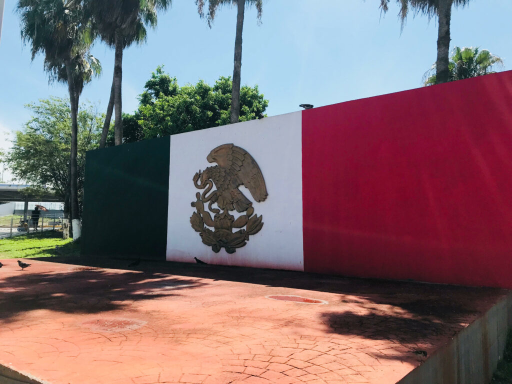 A painted Mexican flag on a wall as seen close to the Tamaulipas Institute for Migrants in Reynosa, Tamaulipas, Mexico