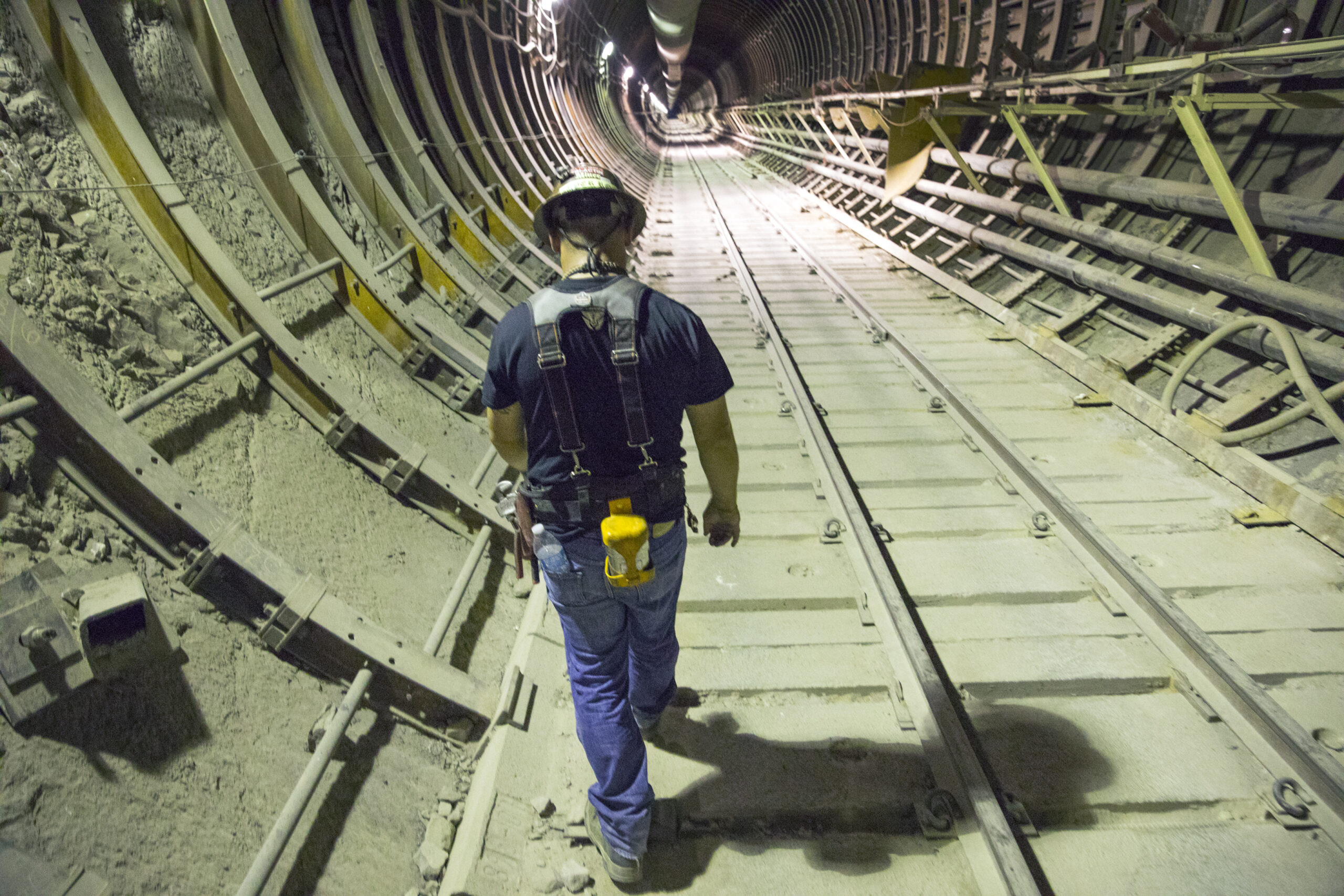 A miner walking inside the South Portal at Yucca Mountain