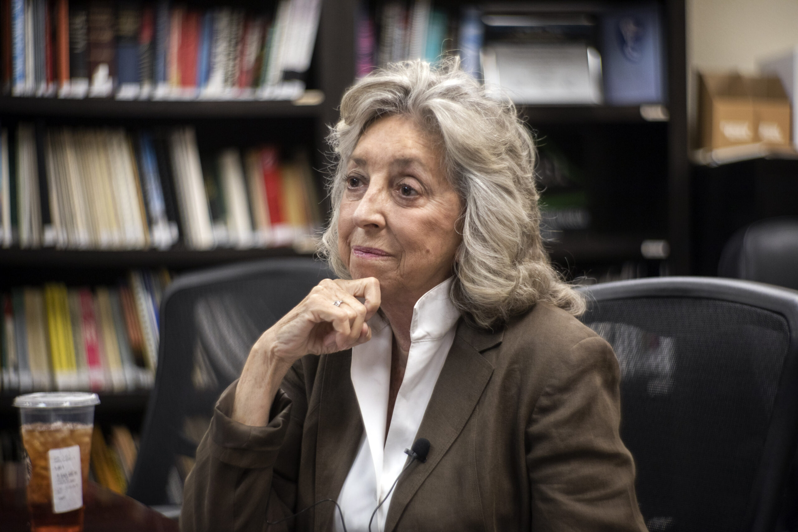 Representative Dina Titus seated and resting her chin on her hand