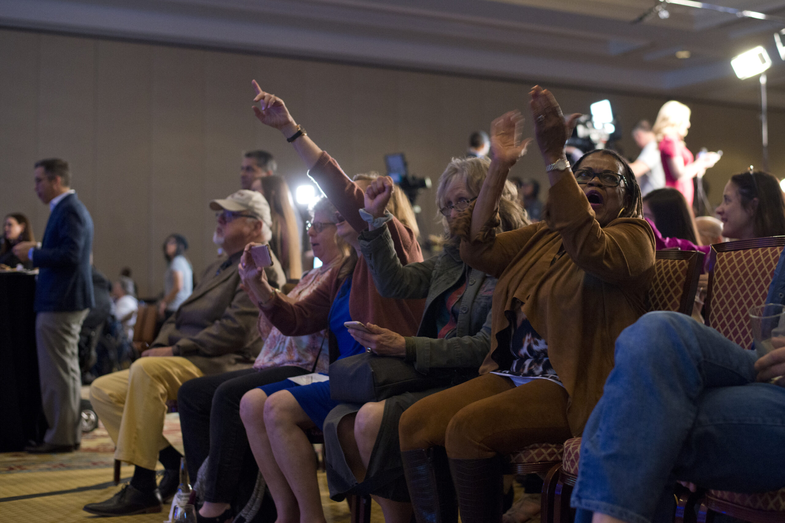 People react after the House is called in favor of Democrats during the Nevada Democratic Party election night event at Caesar Palace
