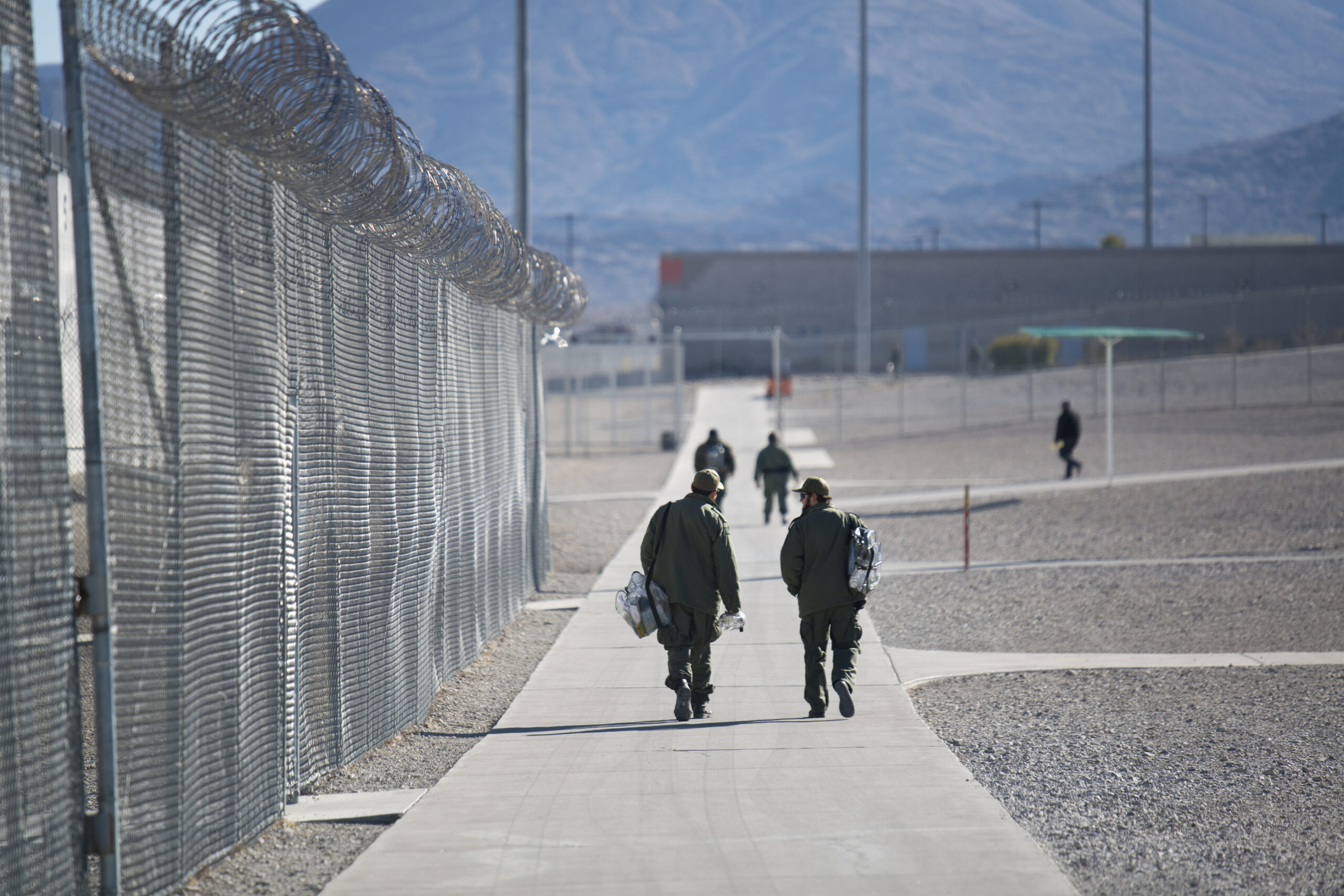 Guards walk inside High Desert State Prison as seen on Friday, Jan. 4, 2019.