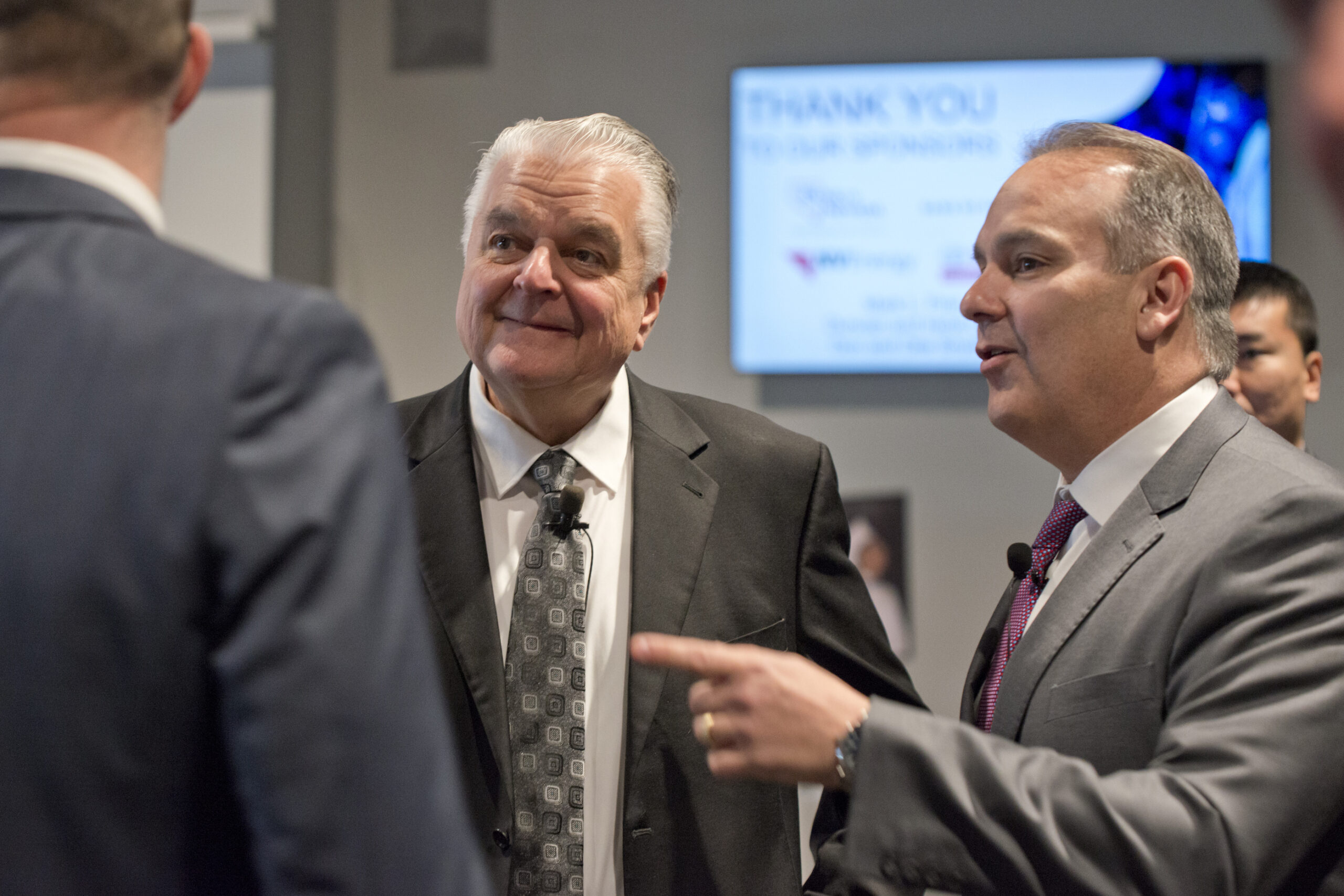 Nevada Governor Steve Sisolak and Clark County Superintendent Jesus Jara speaking with unseen person