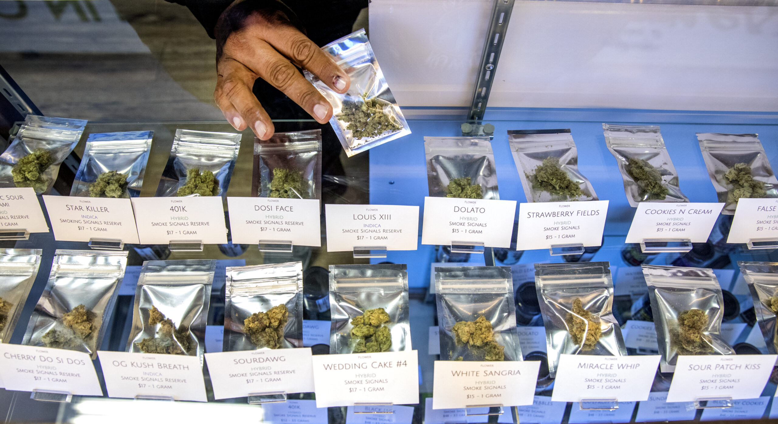 A table of packaged marijuana for sale