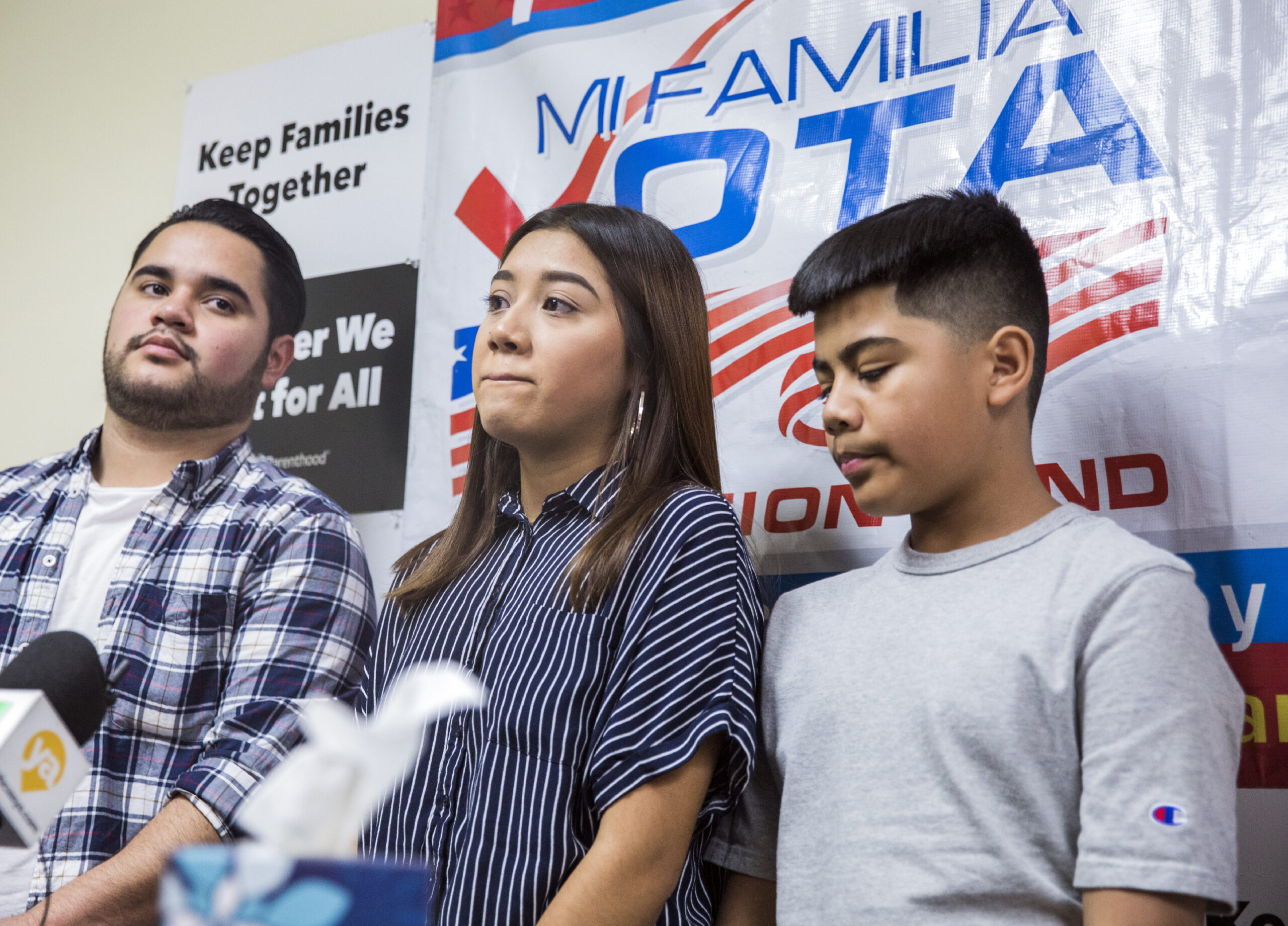 Omar Arellano Cruz, left, 21, Kimberly Arellano Cruz,16, and AJ Arellano Cruz ,12, during a news conference on Monday, July 15, 2019