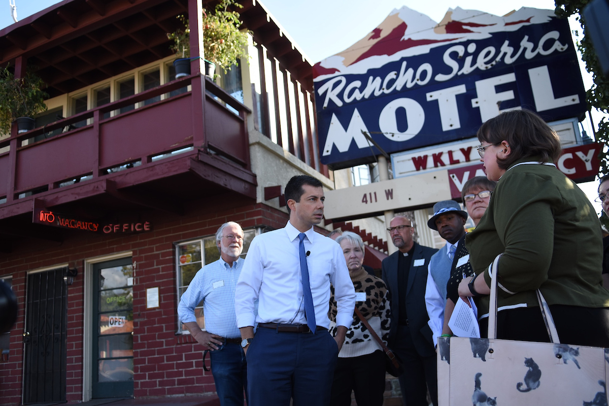 South Bend Mayor Pete Buttigieg tours the weekly motels in Downtown Reno