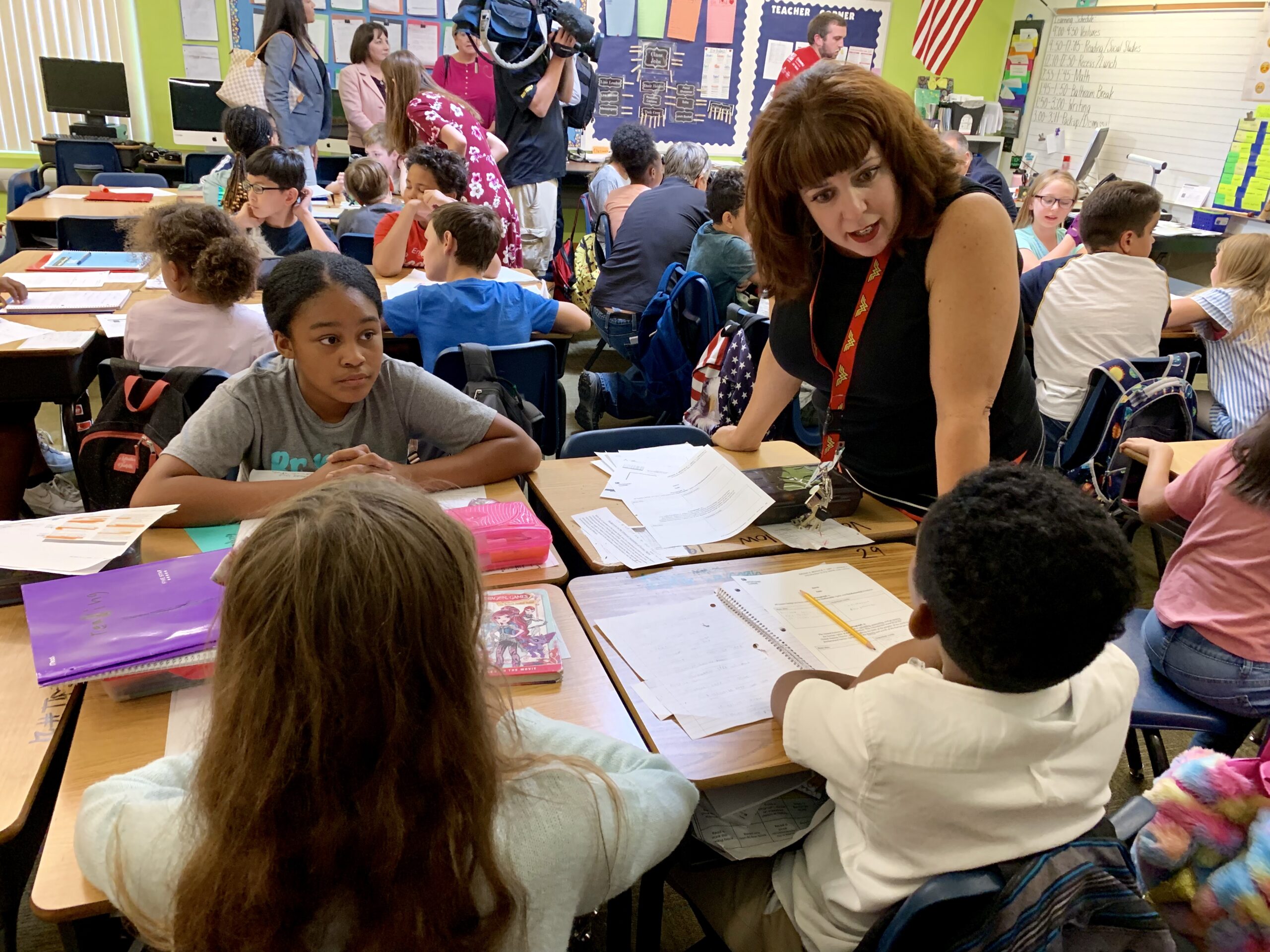 Fifth-grade teacher MaryAnn Thomson talks with her students