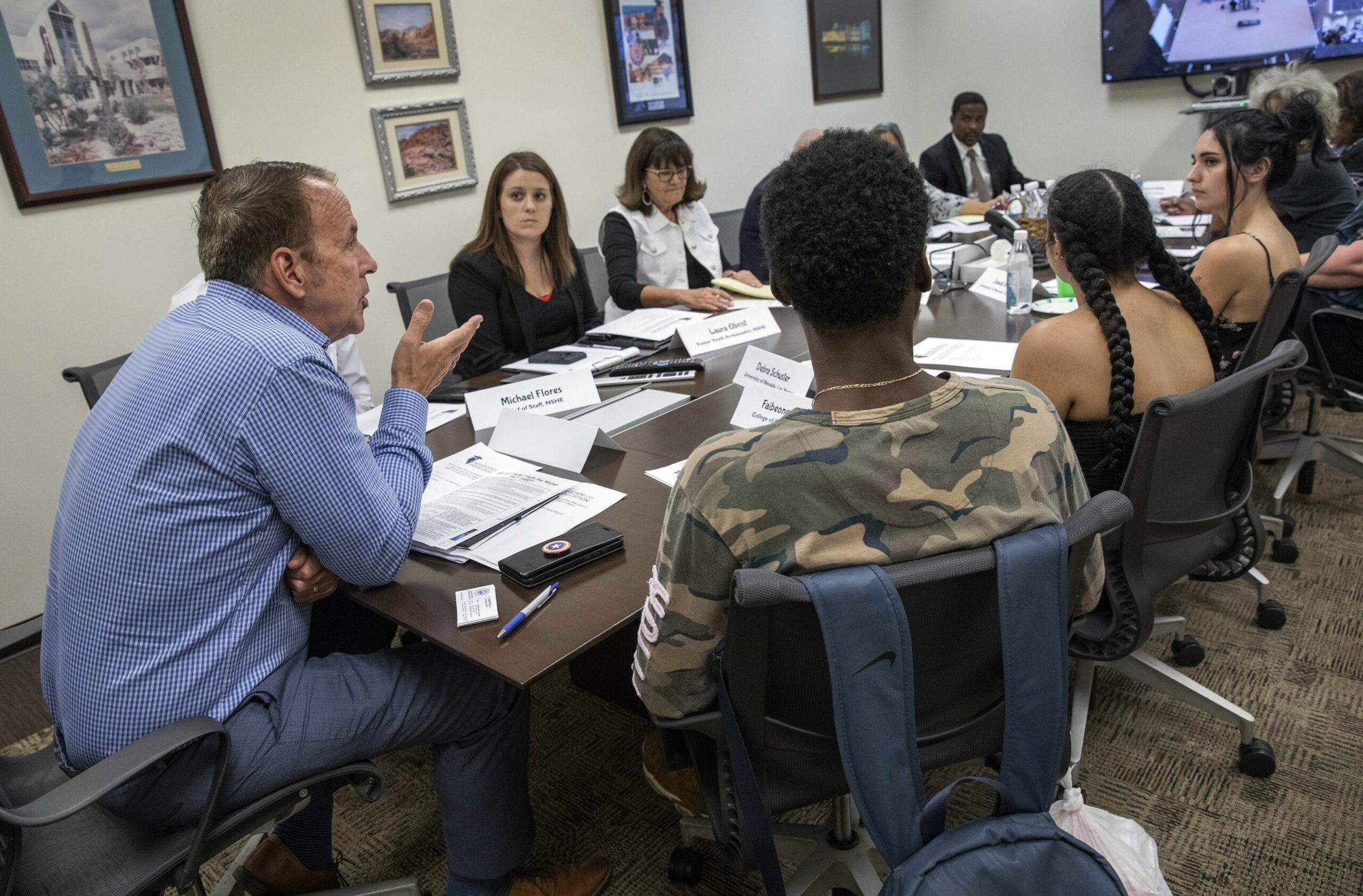 Nevada System of Higher Education Chancellor Thom Reilly, left, leads a roundtable discussion on how to provide higher education opportunities for foster students