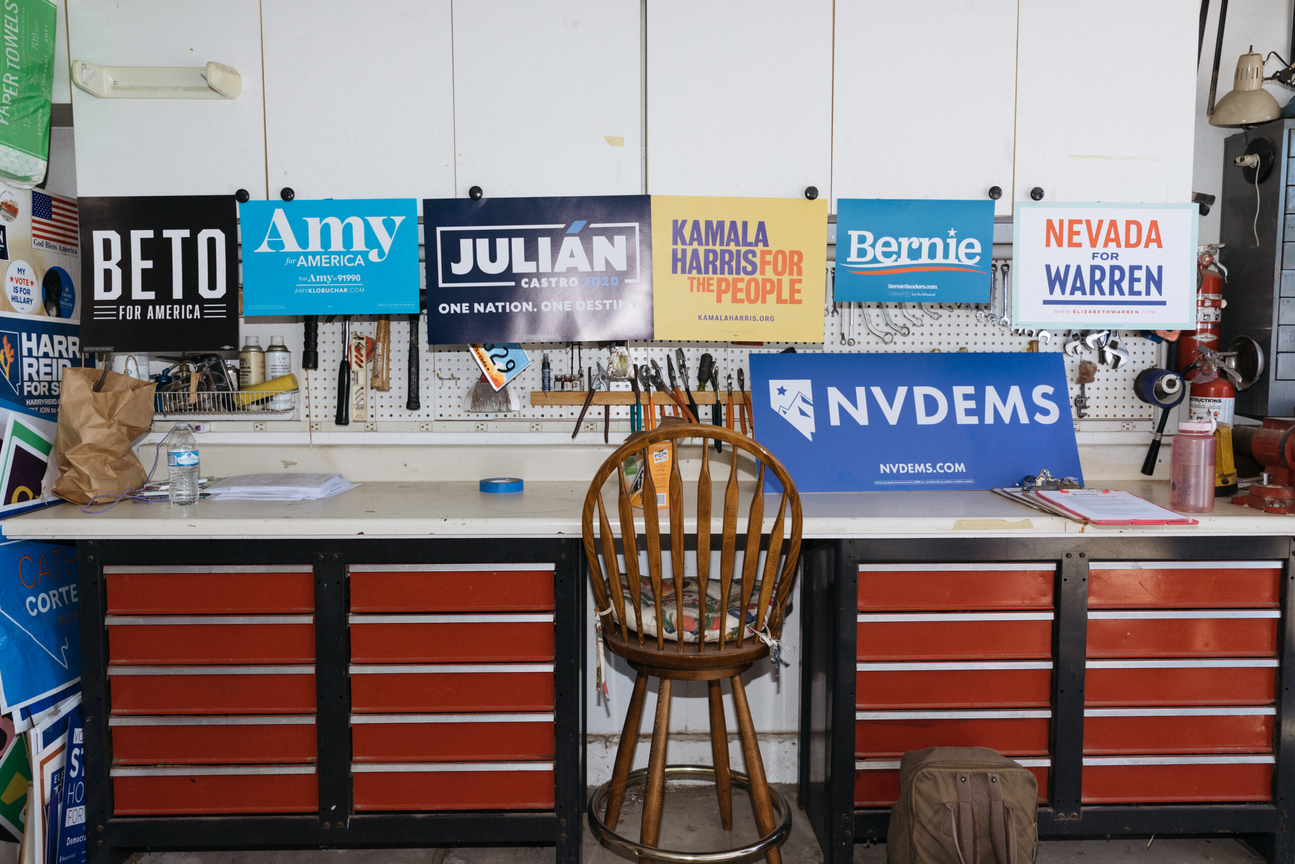 A desk and chair with Democratic party signs sitting on top.