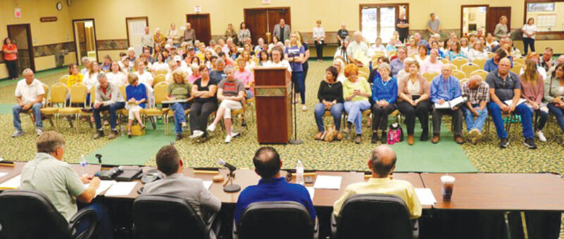 Community members at city council meeting