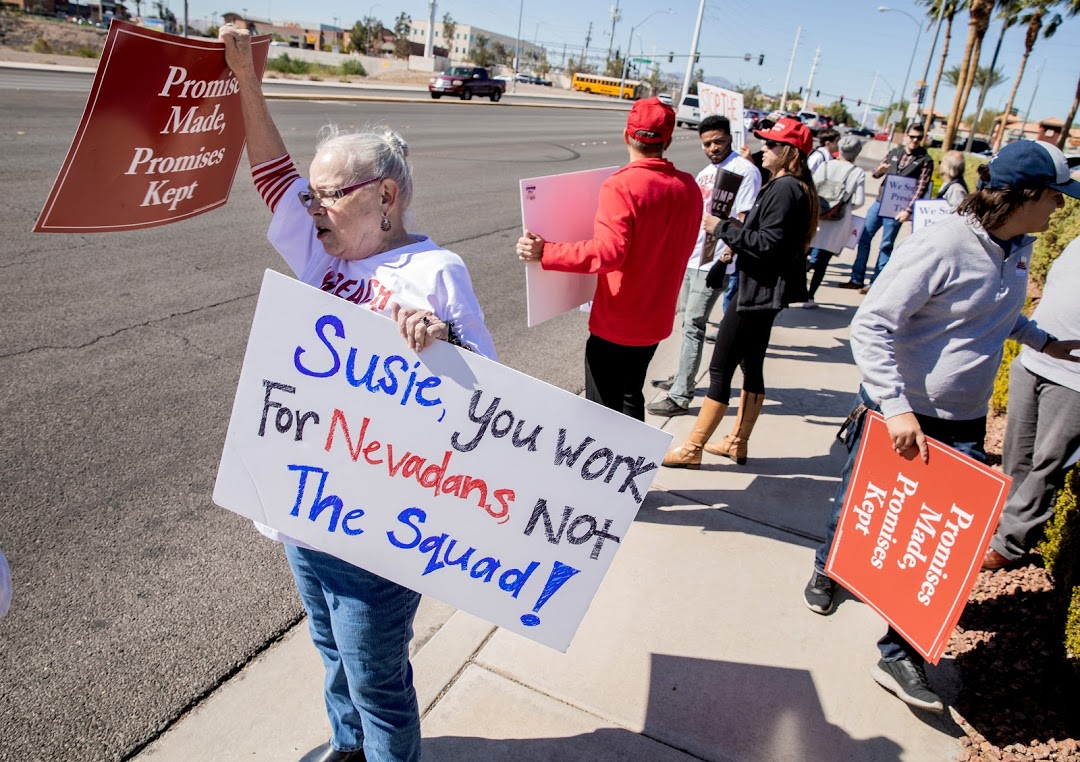 President Donald Trump supporter Barbara Elmgram demonstrates in front of Congresswoman Susie Lee's Las Vegas office