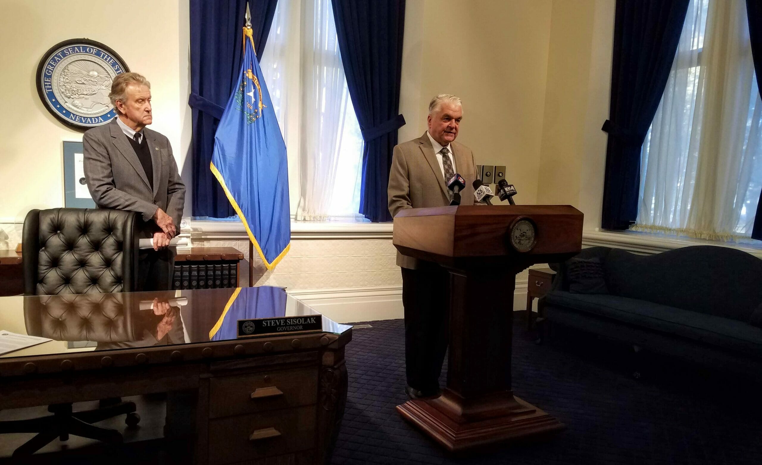 Gov. Steve Sisolak standing in his office