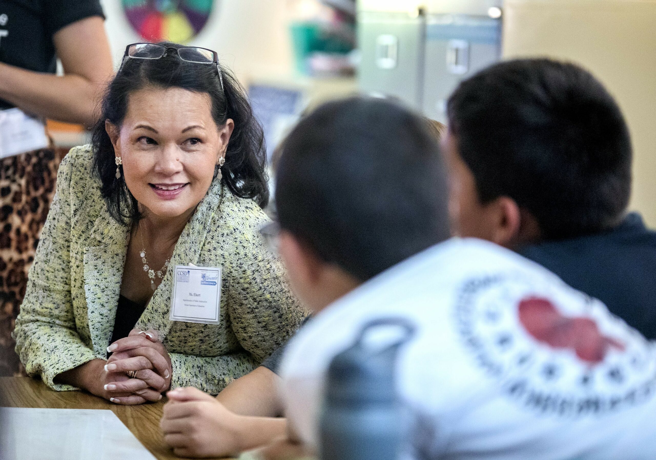 State Superintendent Jhone Ebert talks with students in a STEM class at Helen Marie Smith Elementary School