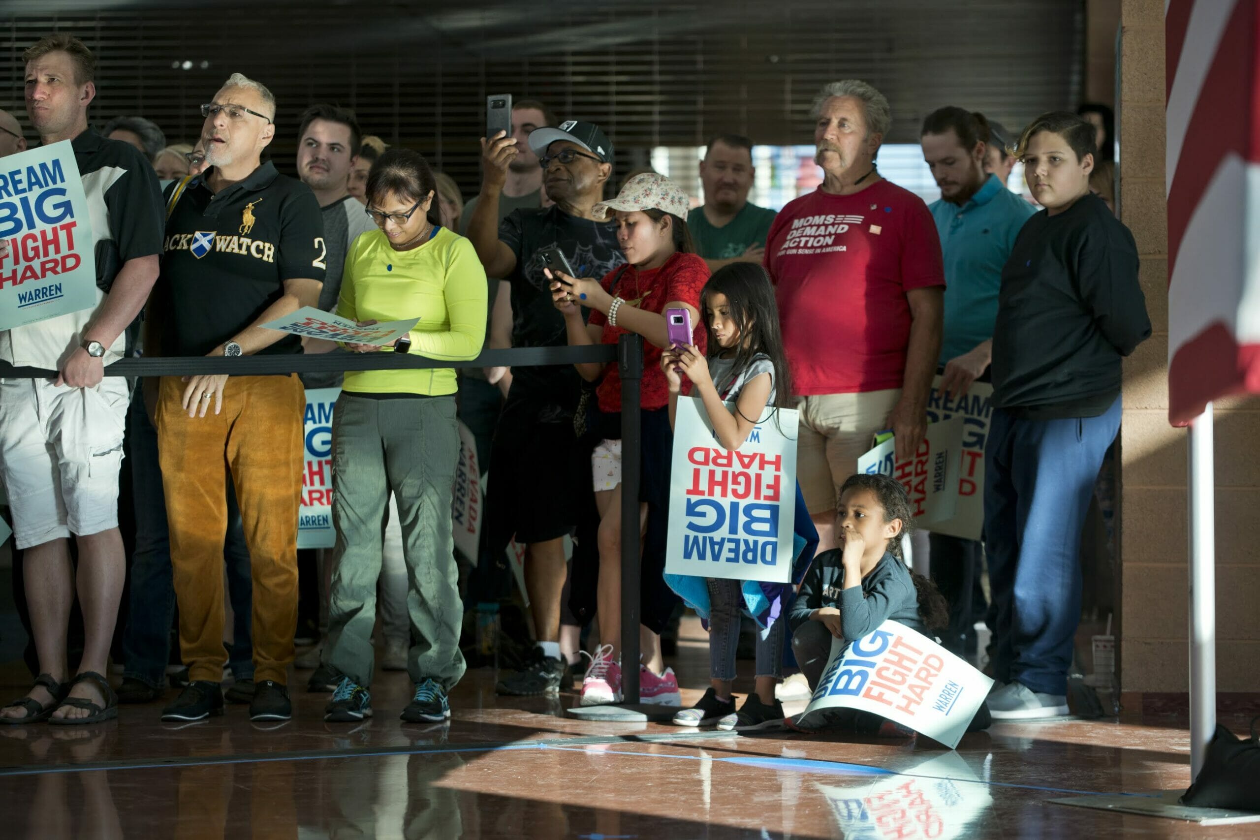 A group of people listening during a campaign event