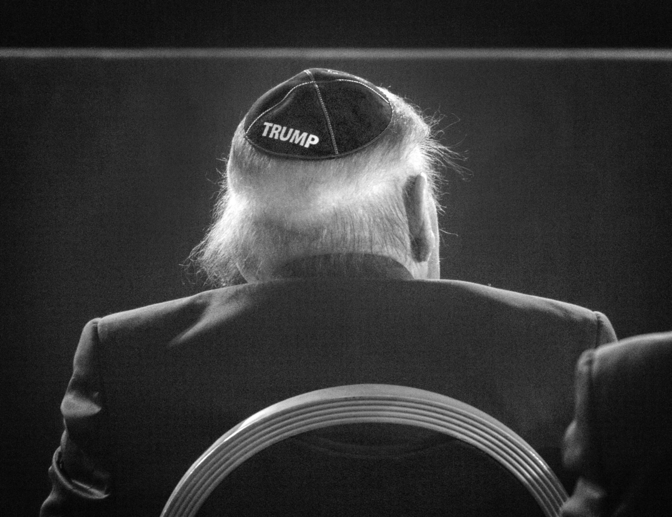 A black and white photo of a yarmulke with the name Trump on it