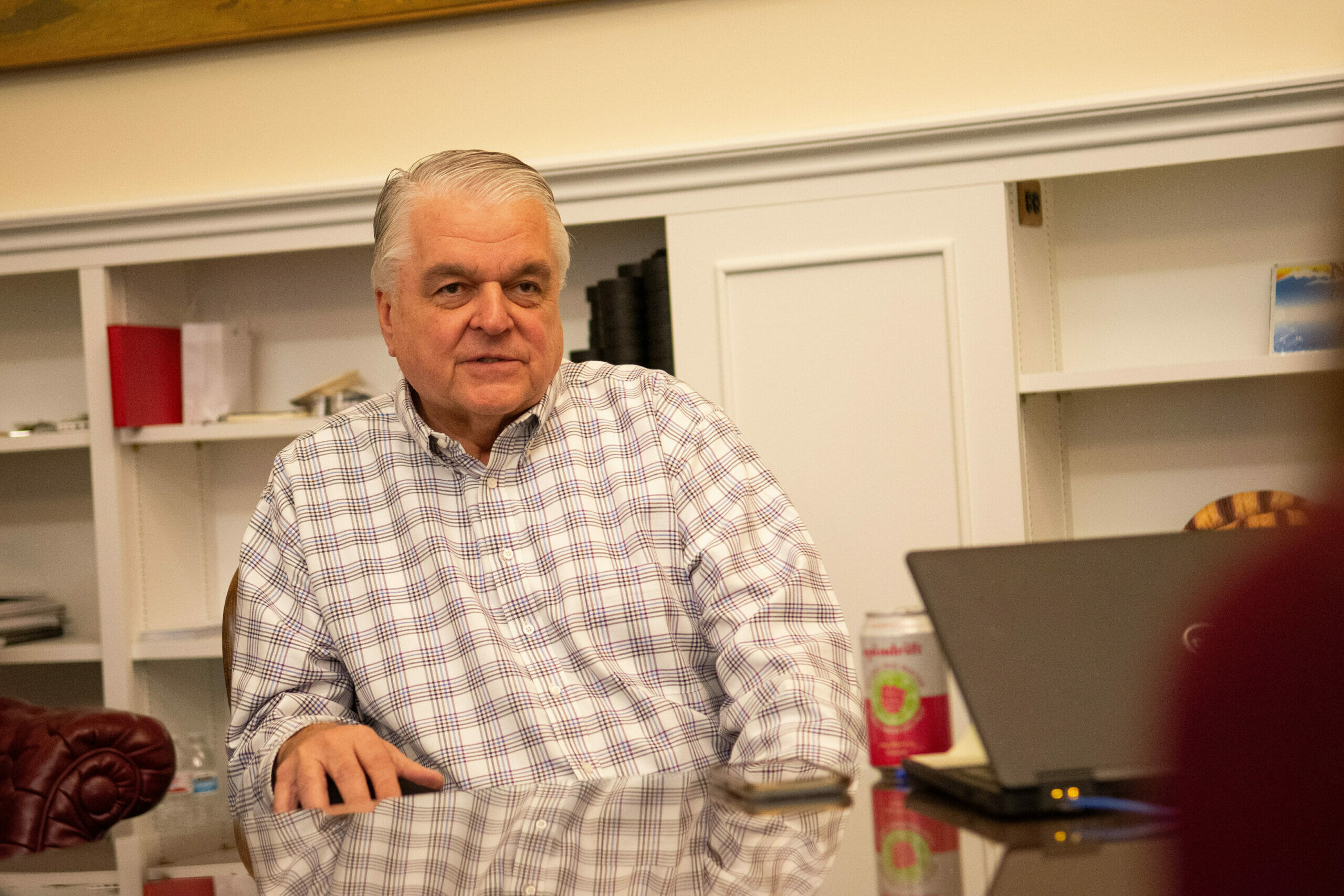 Steve Sisolak seated during conversation