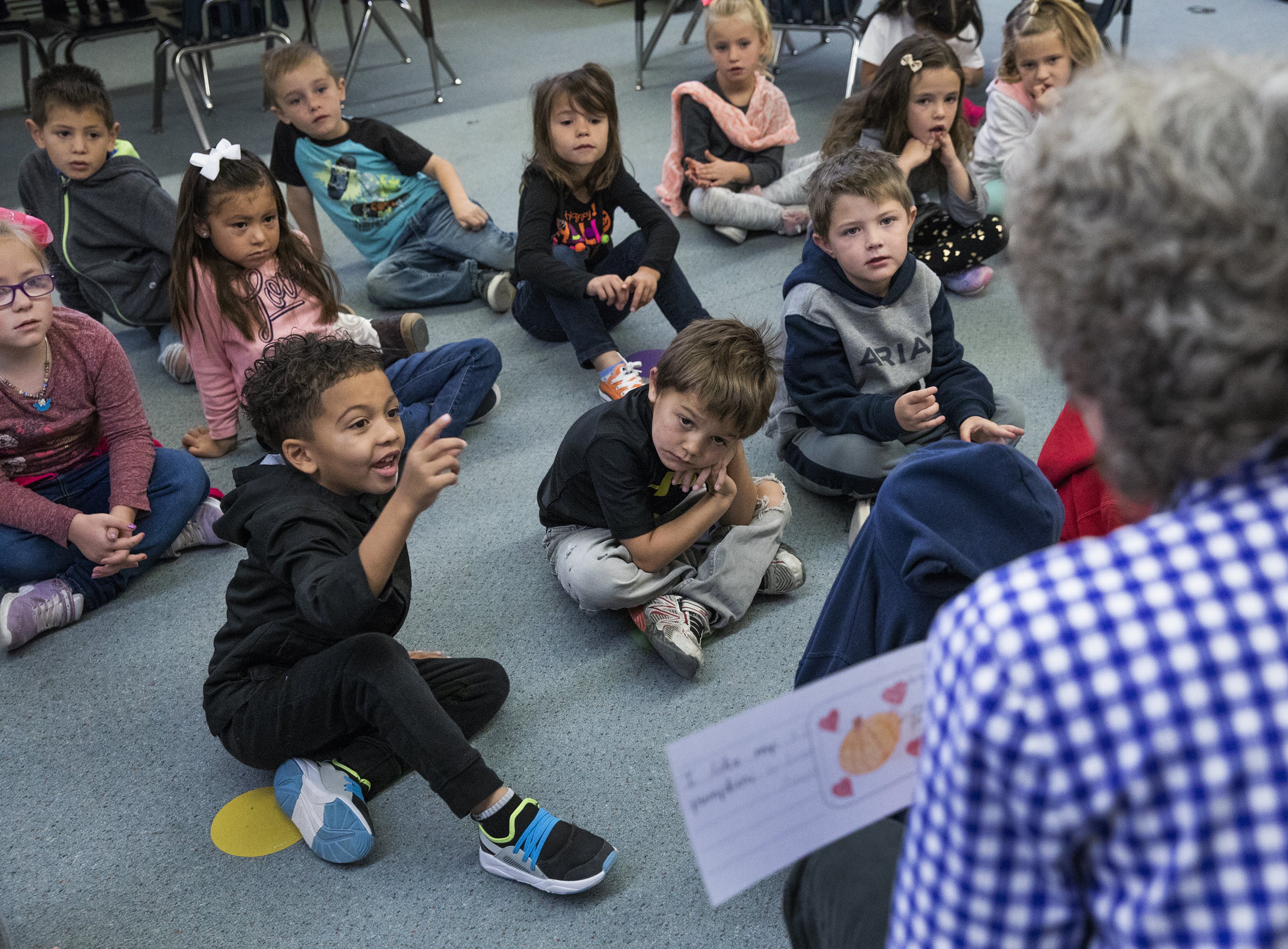 Kindergarten teacher Jody Crampton reads aloud to her students in David E. Norman Elementary School