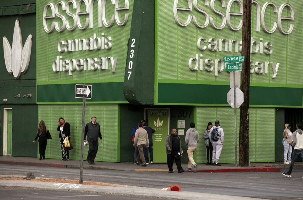 Group of pedestrians outside Essence Cannabis Dispensary