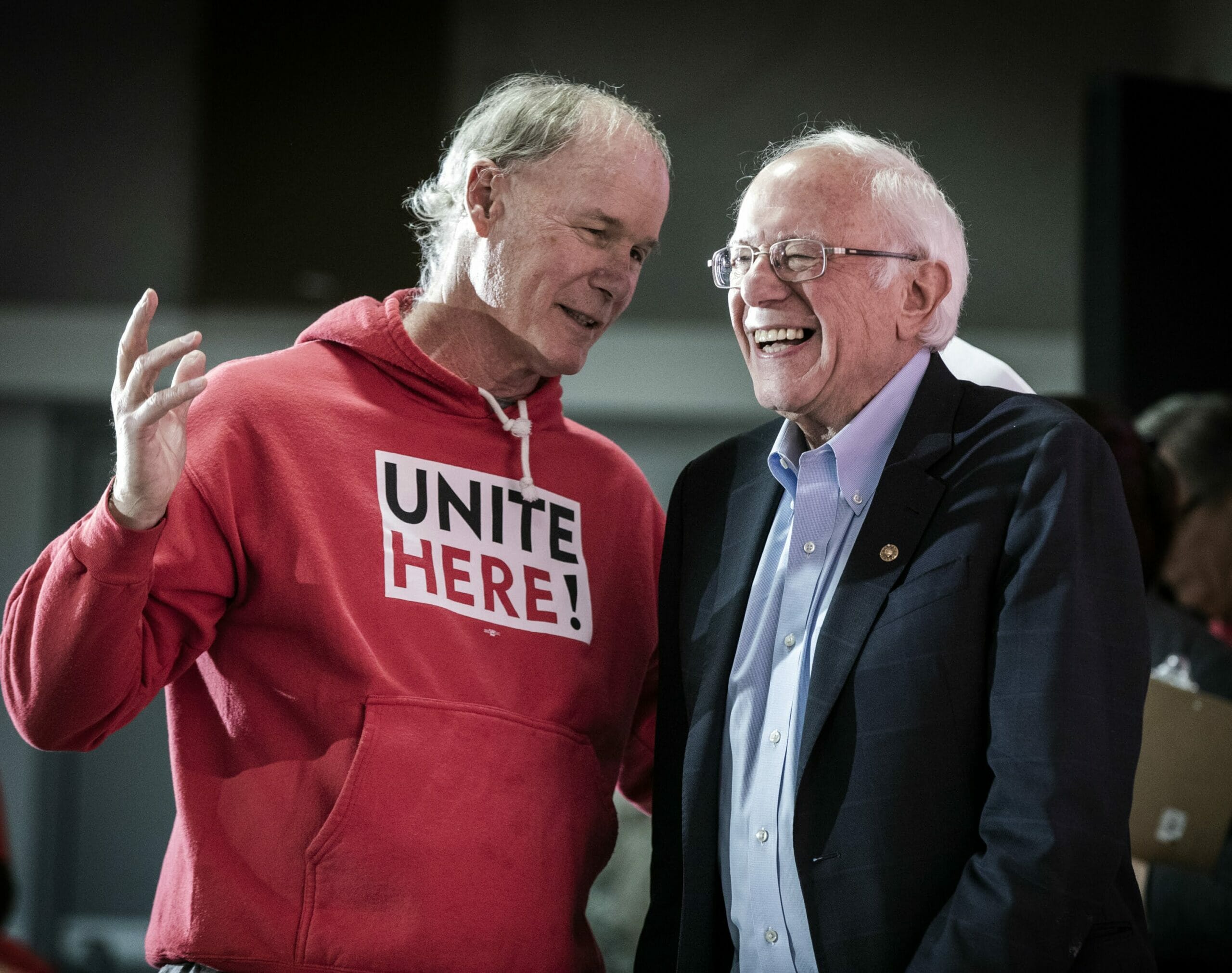 D. Taylor in a red Unite Here sweatshirt with Bernie Sanders in a dark suit jacket