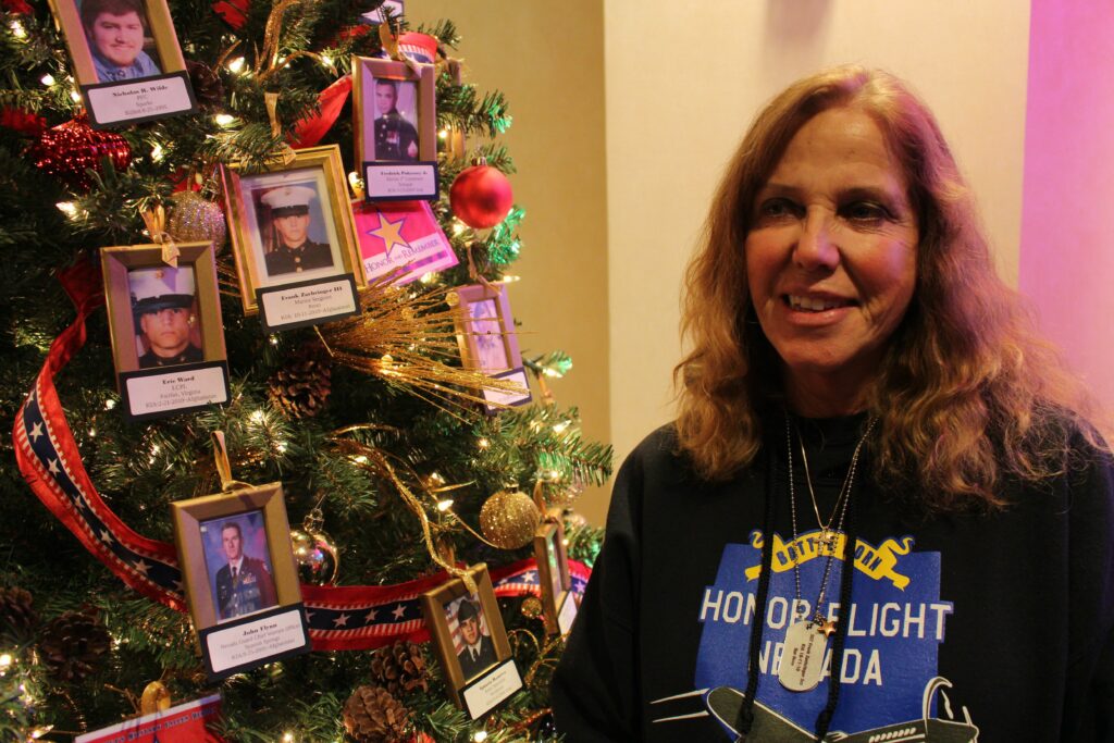 Sharon Zaehringer next to Christmas tree