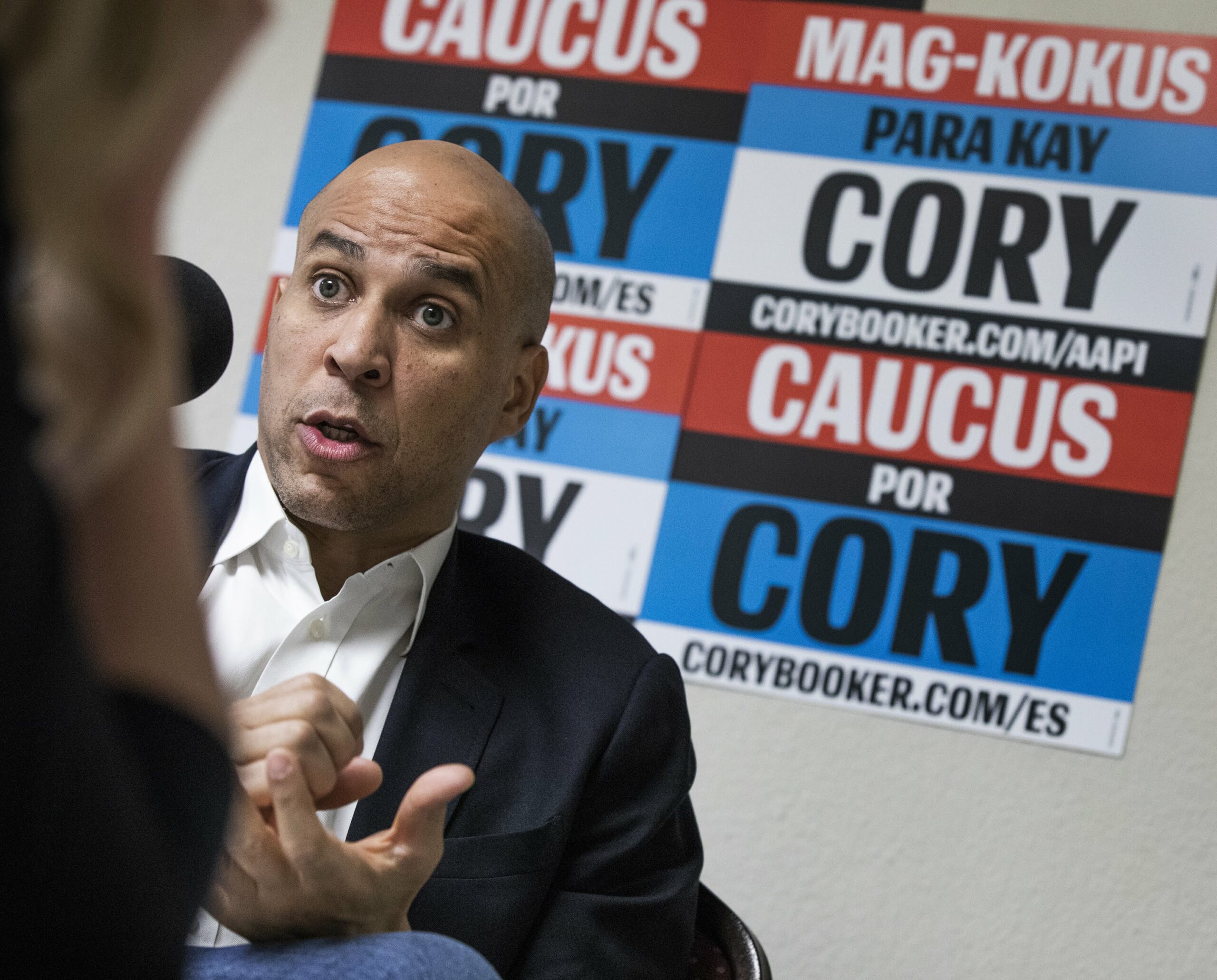 New Jersey Senator Cory Booker seated during an interview