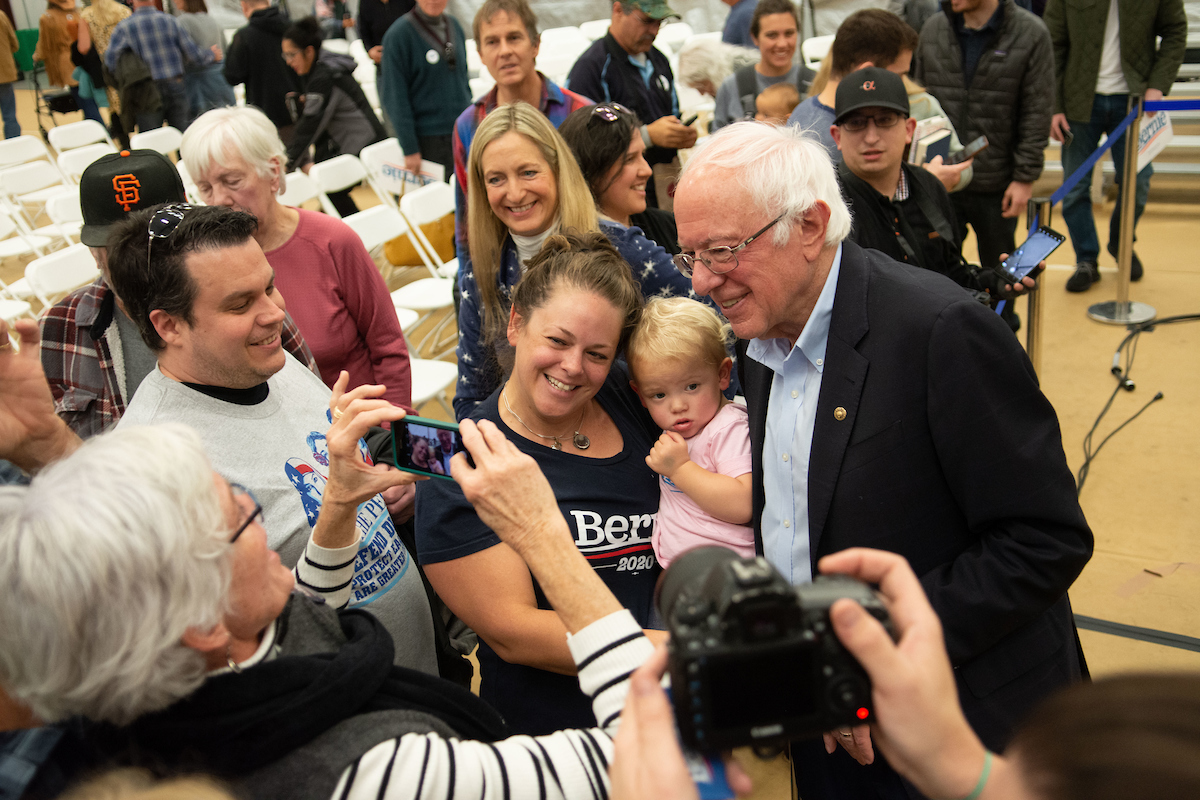 Bernie Sanders poses with fans