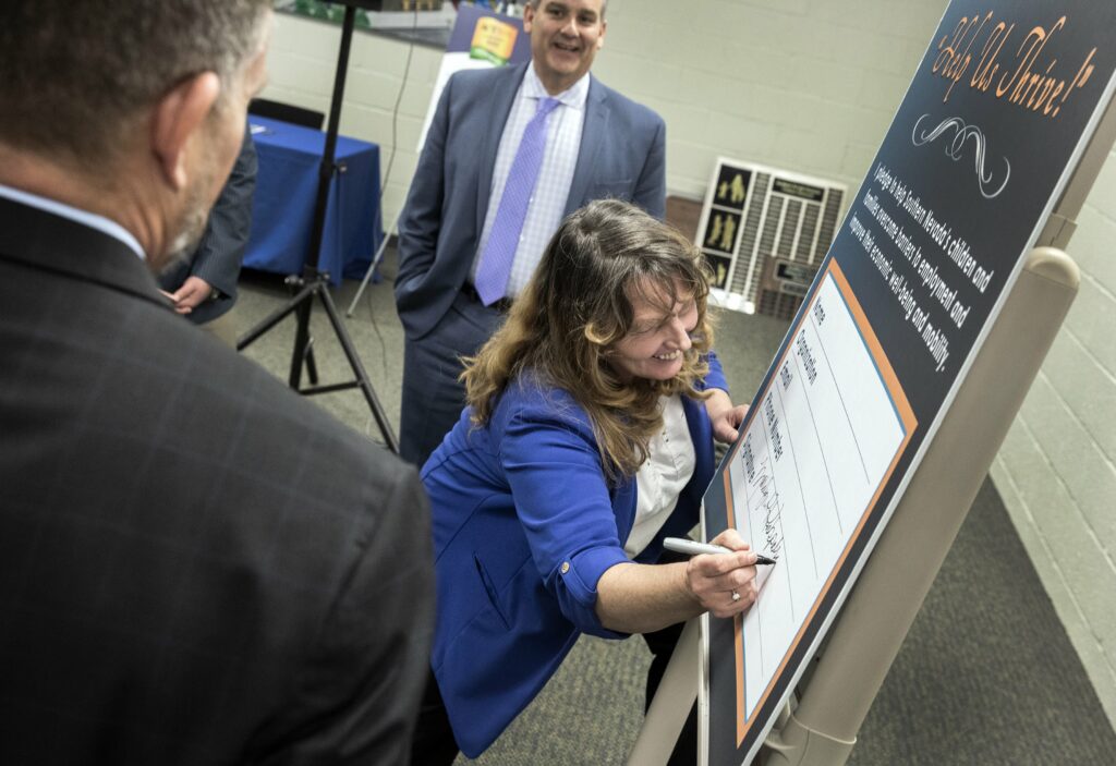 Marilyn Kirkpatrick signing anti-poverty pledge