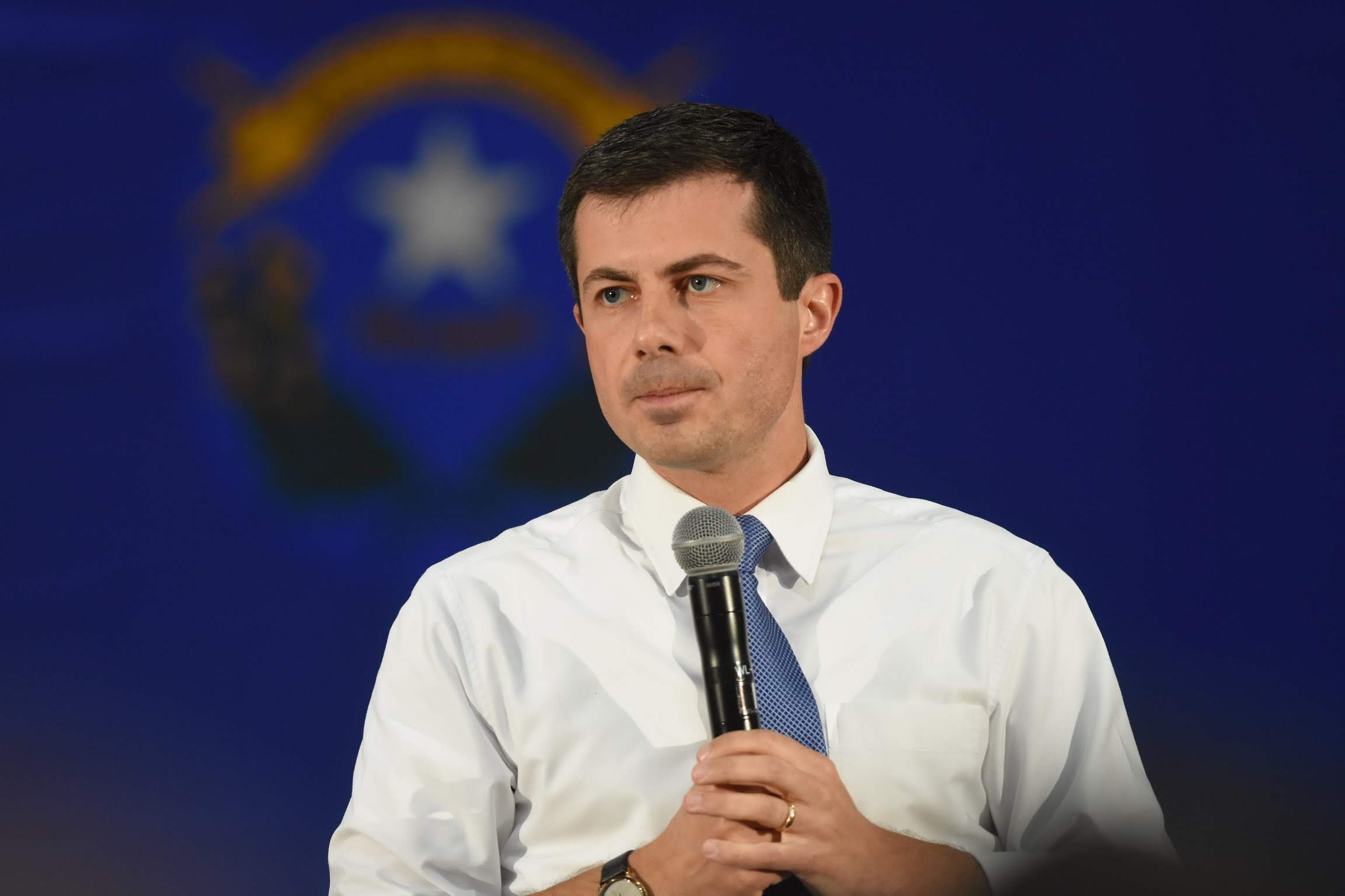 Pete Buttigieg in in front of Nevada flag