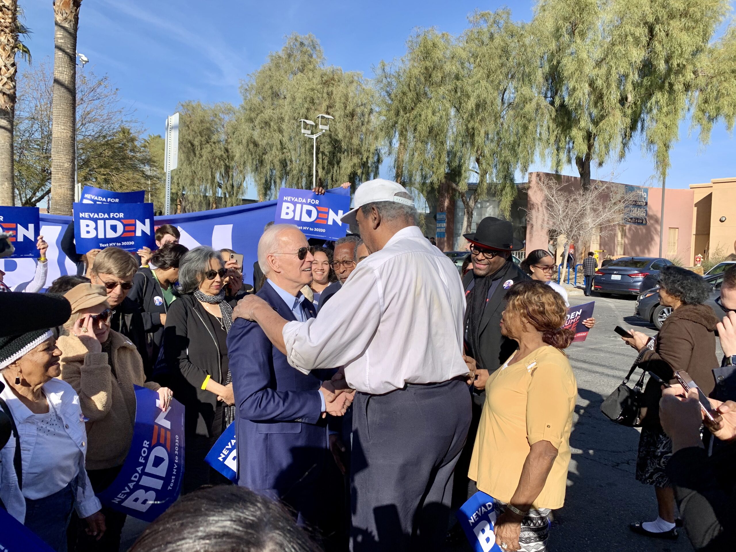 Former Nevada Assemblyman Harvey Munford greets former Vice President Joe Biden outside of Doolittle Community Center