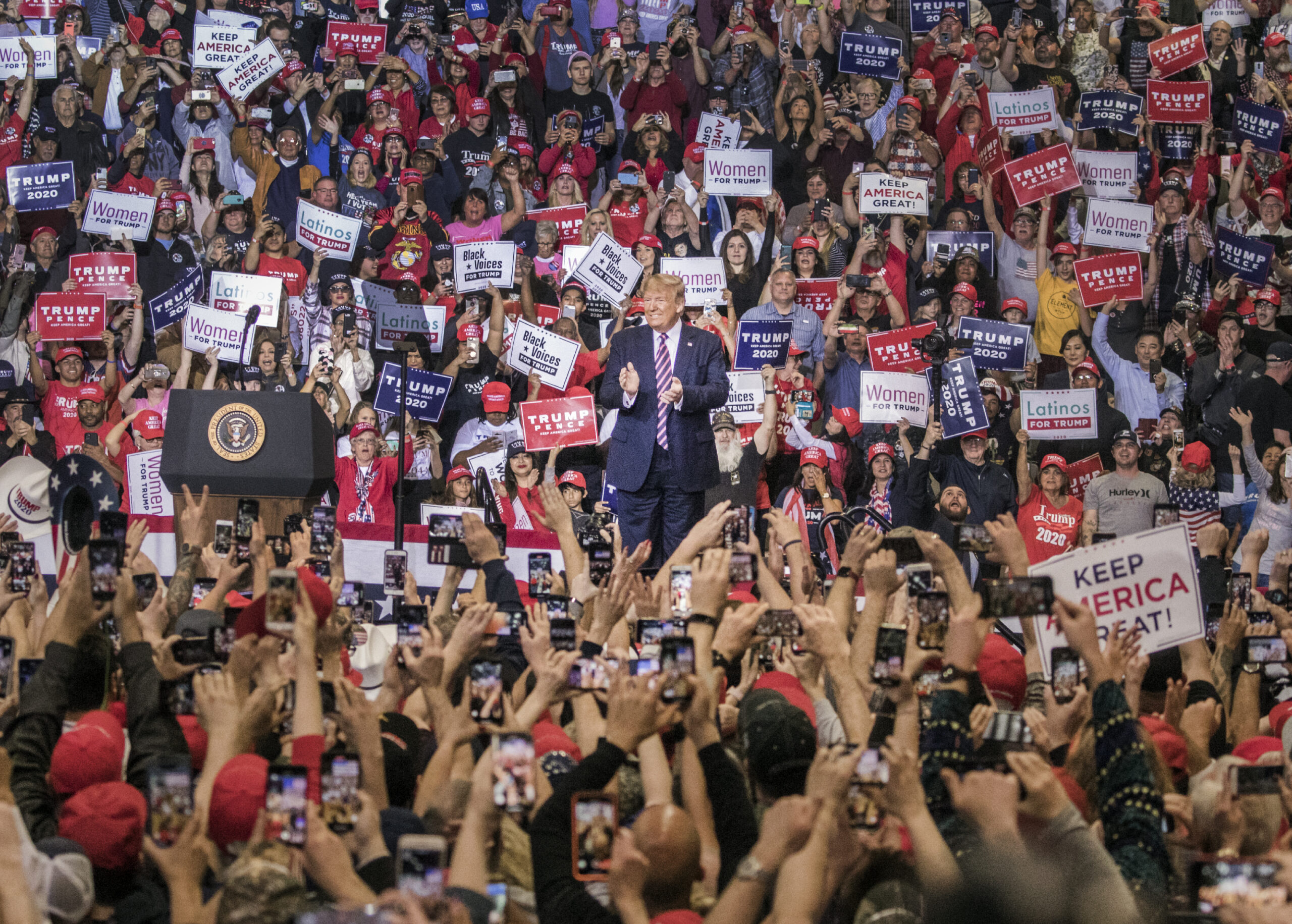 Supporters cheer for President Donald Trump's during a rally at the Las Vegas Convention Center