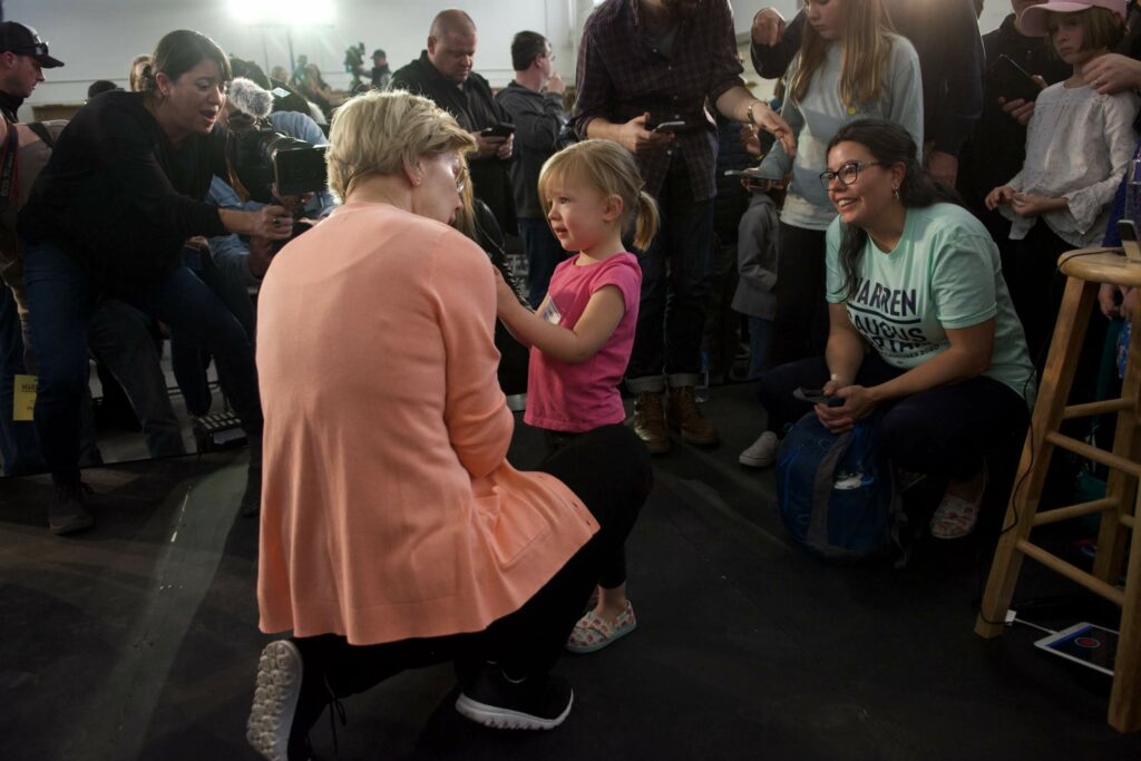 Elizabeth Warren talks with child