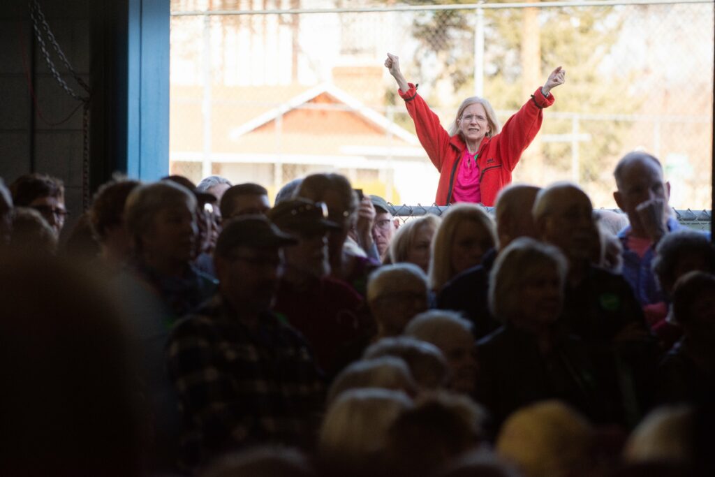 Woman raising arms in victory