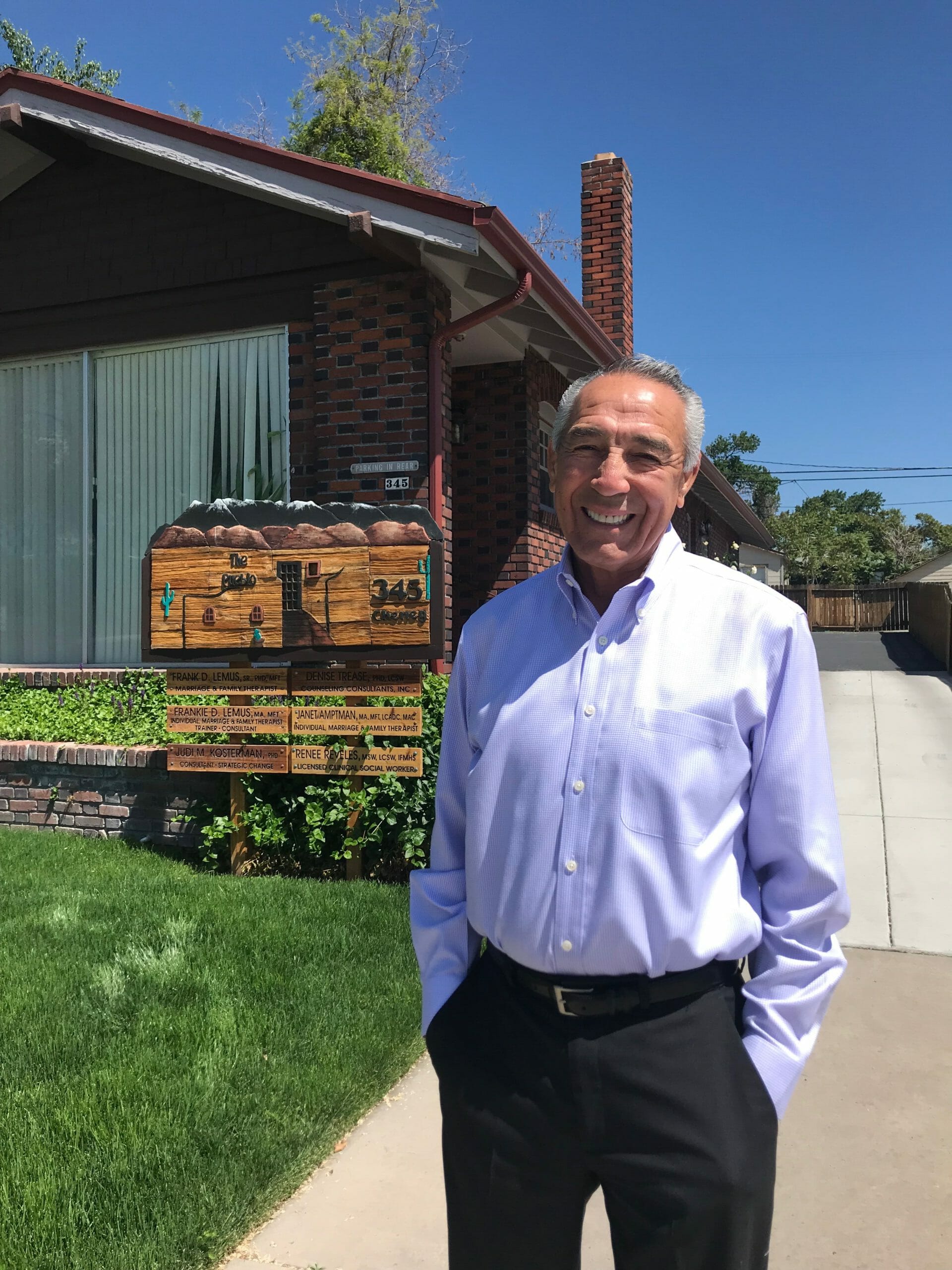 Dr. Frank Lemus stands outside of his counseling practice.