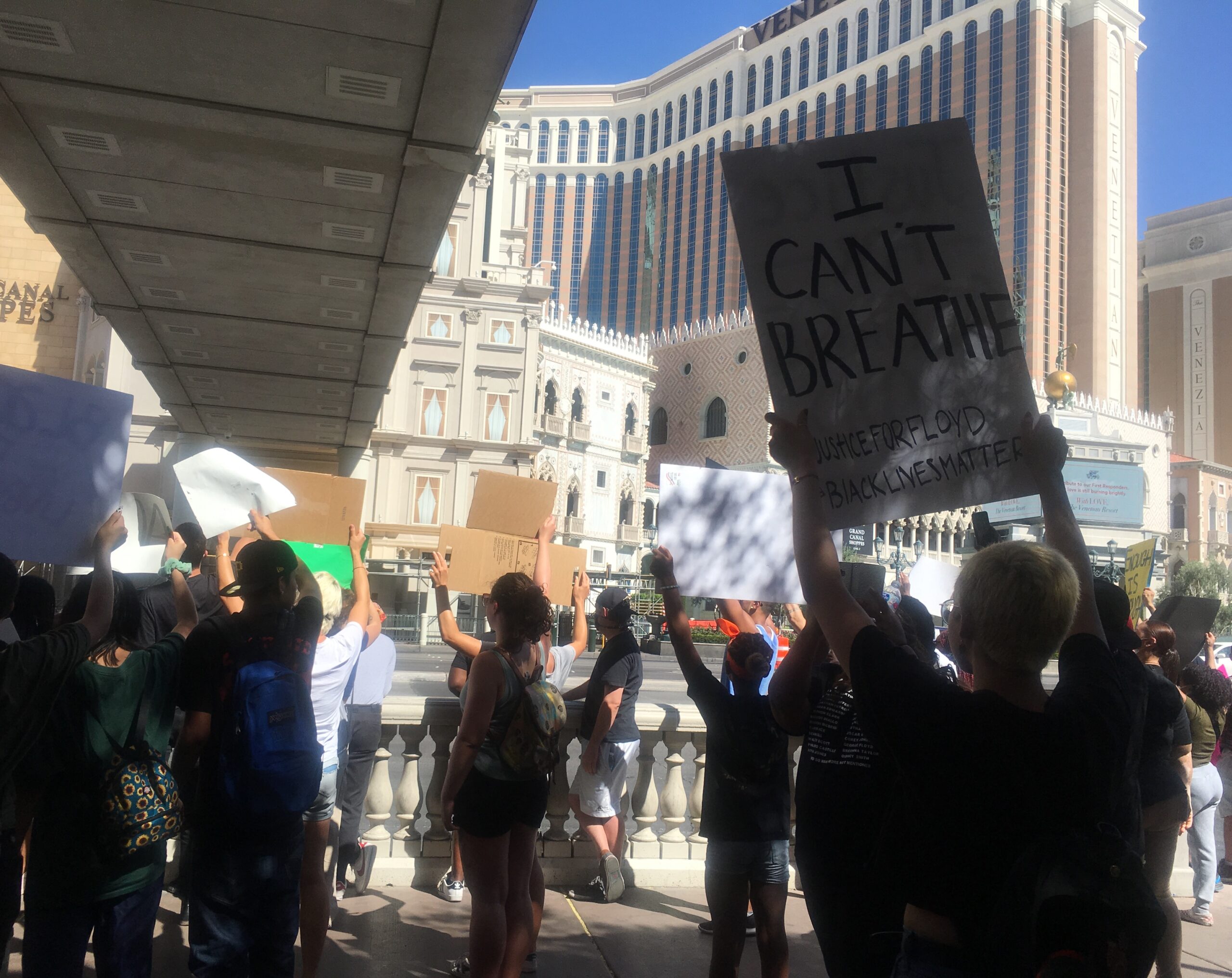 Girl holds protest sign