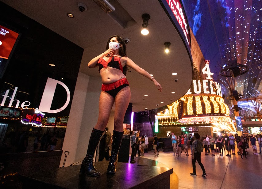 Las Vegas, Nevada - A man hands cards for ´hot sexy girls´ to tourists on  The Strip